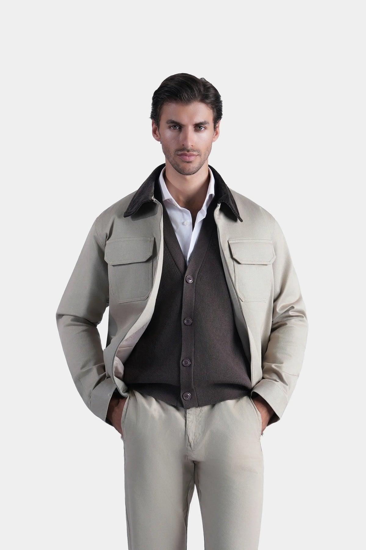 Khaki full-sleeve jacket with flap pockets and buttoned front, relaxed fit