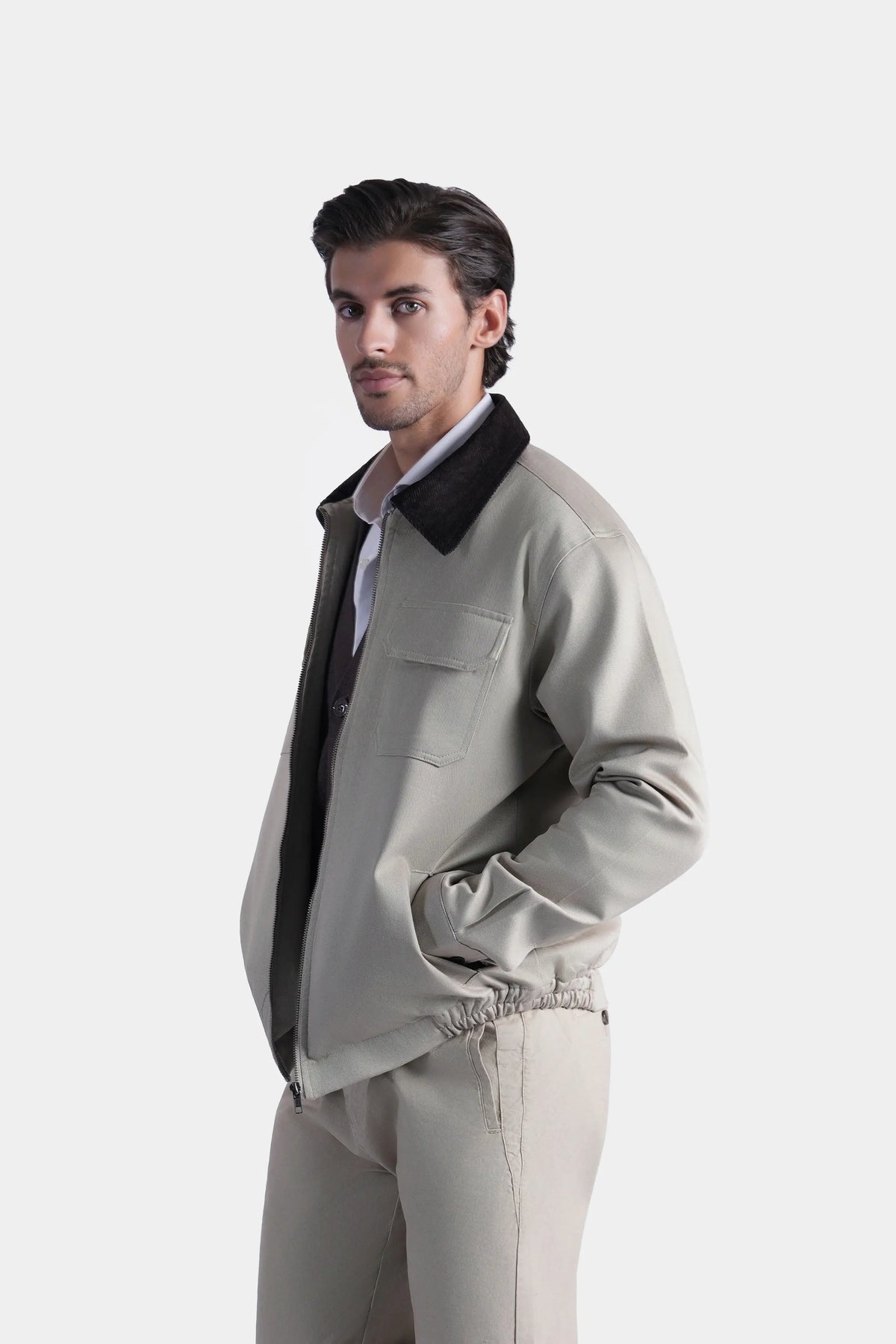 Khaki jacket front three-quarter view with dark collar and chest flap pocket