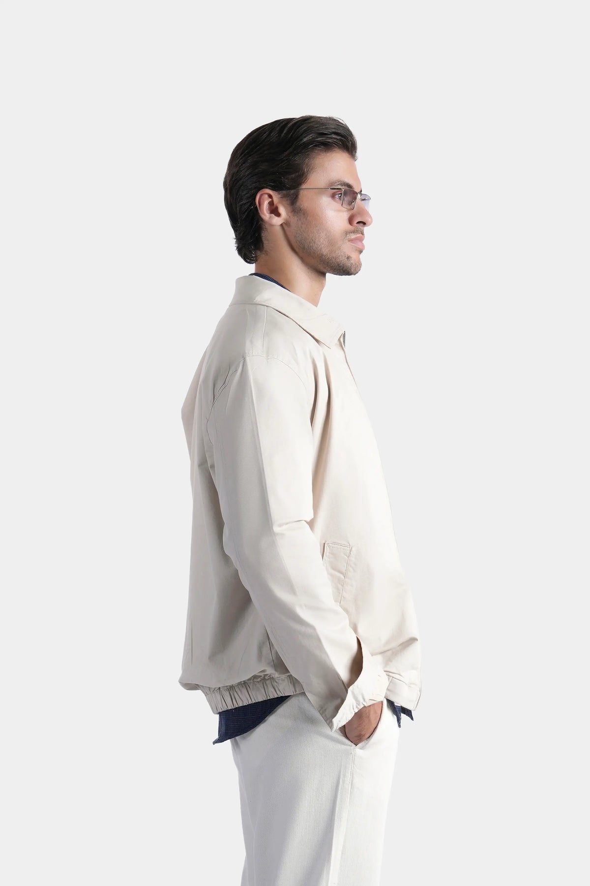 Beige relaxed-fit full-sleeve jacket, side view with stand collar and elastic cuffs