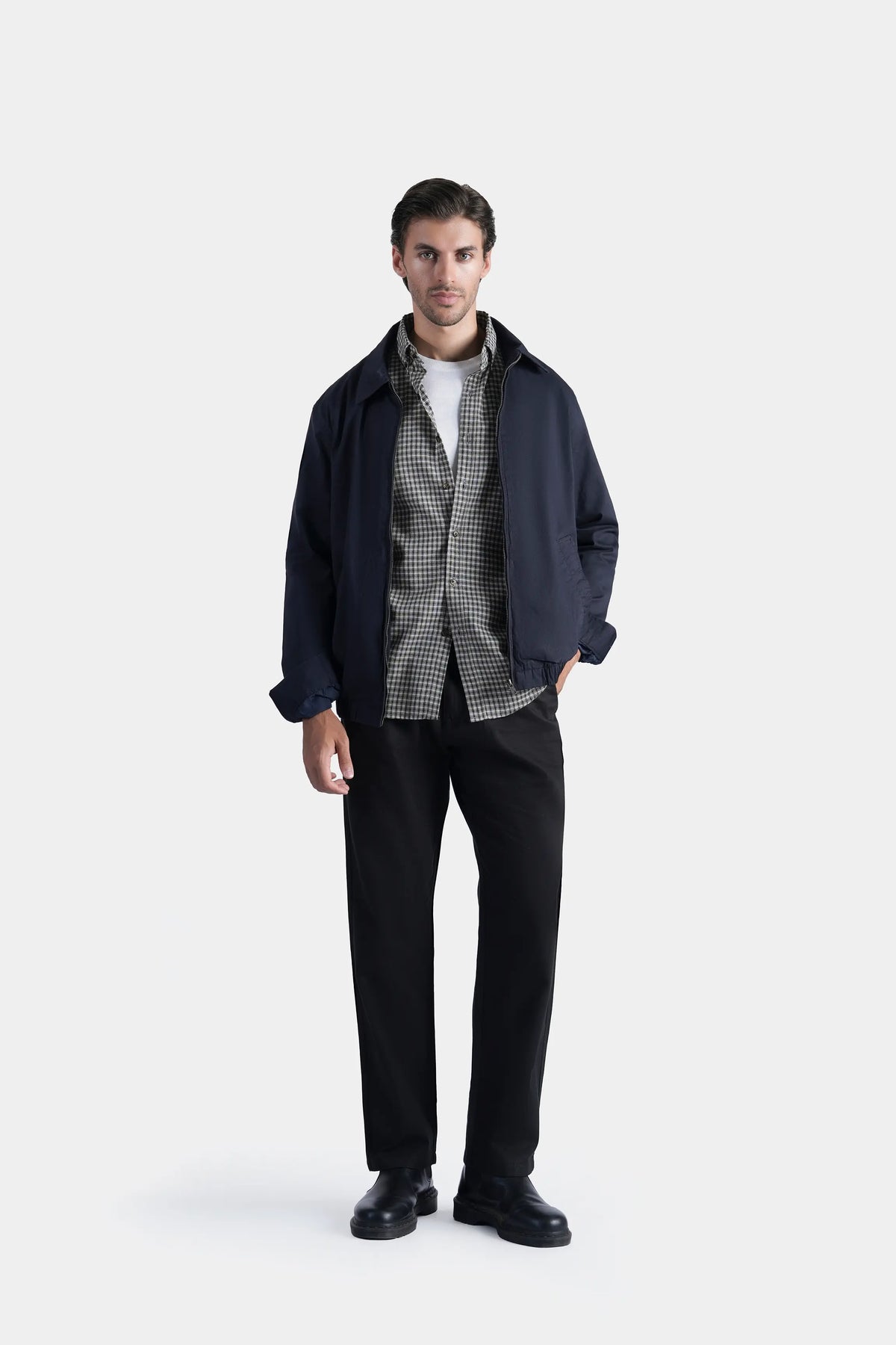 Dark navy relaxed-fit full-sleeve jacket with open collar, worn over shirt