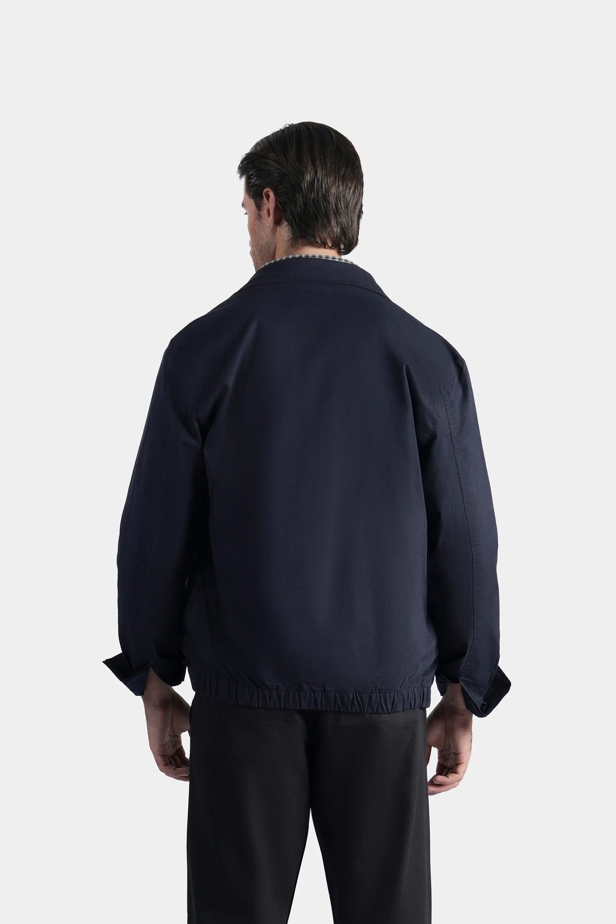 Dark navy relaxed-fit full-sleeve jacket, back view with elastic hem