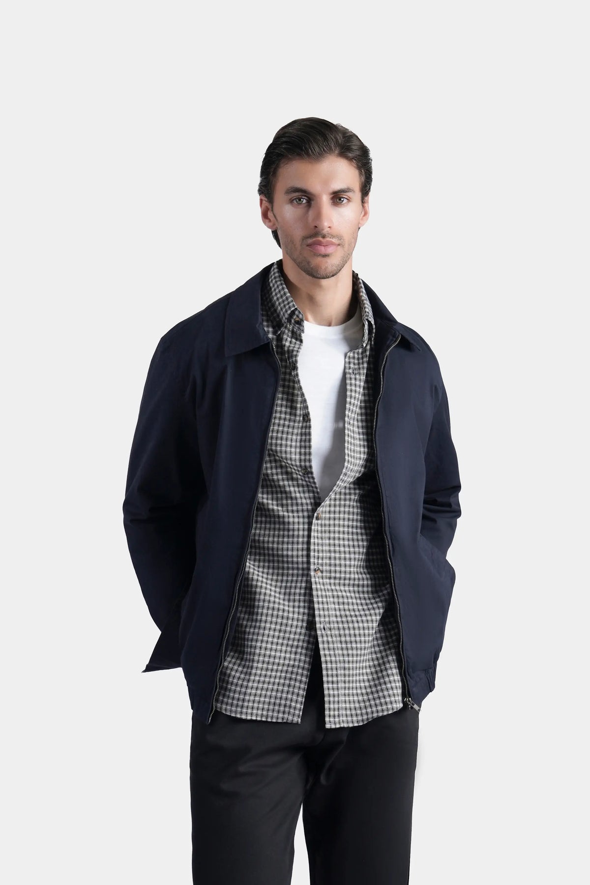 Dark navy relaxed-fit full-sleeve jacket with open collar, layered over check shirt