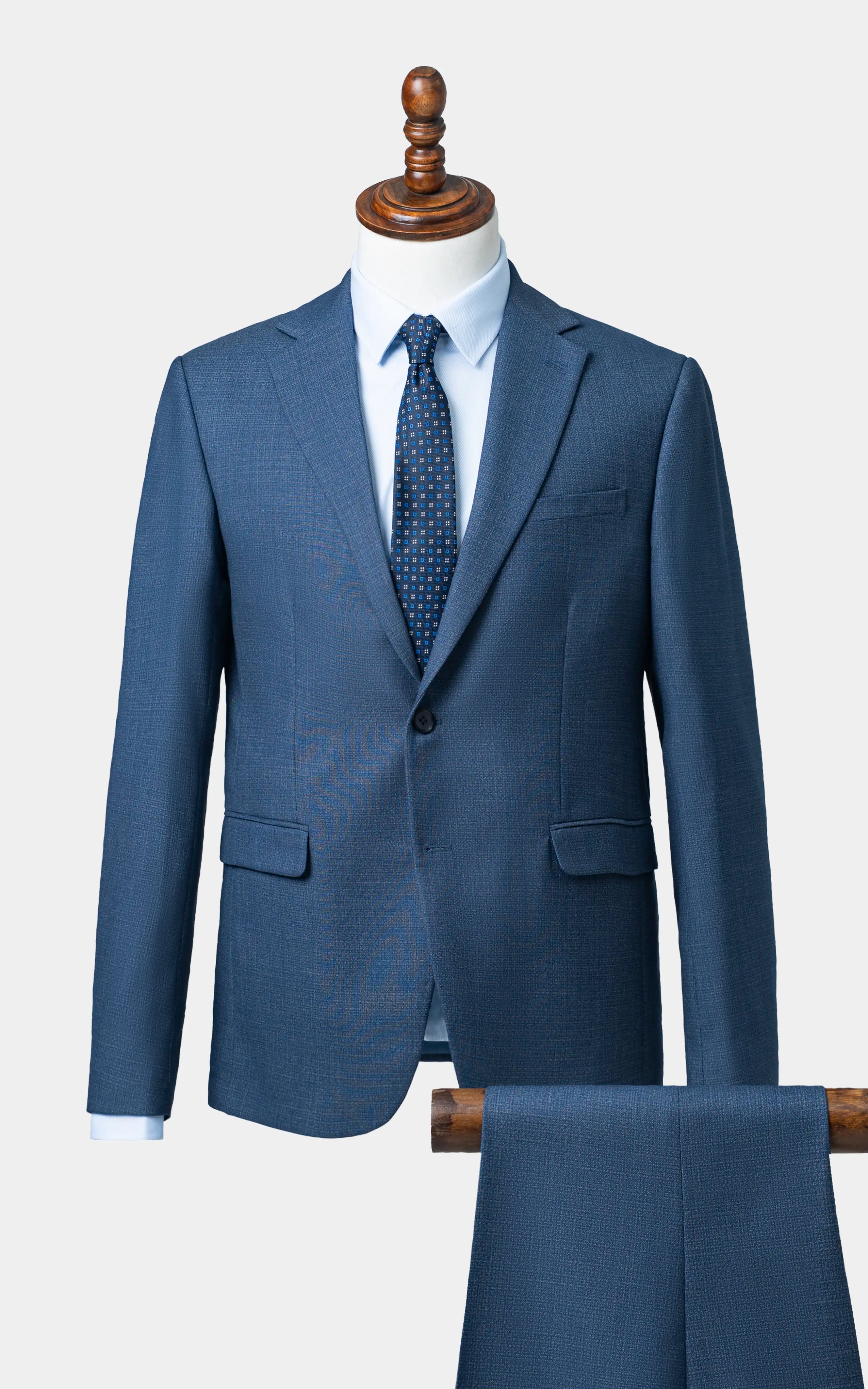 Blue two-piece suit jacket and matching trousers, notch lapels, two front pockets