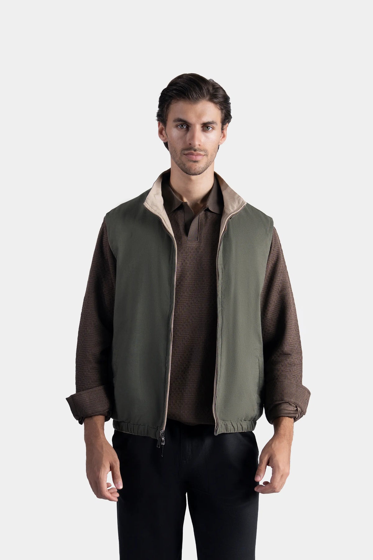 Reversible sleeveless jacket, olive side with stand collar and zip front