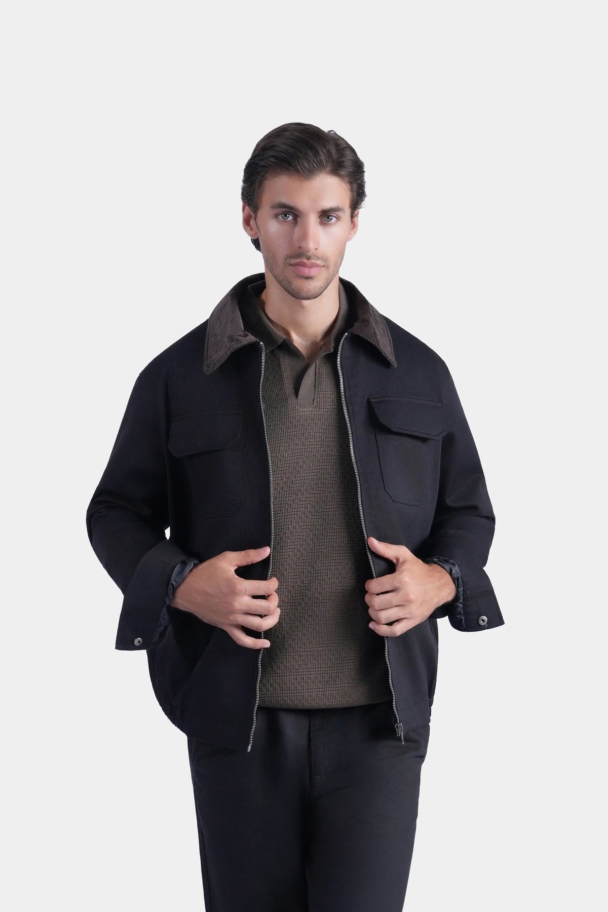Men's black relaxed-fit long-sleeve jacket with shirt collar and flap pockets, front view