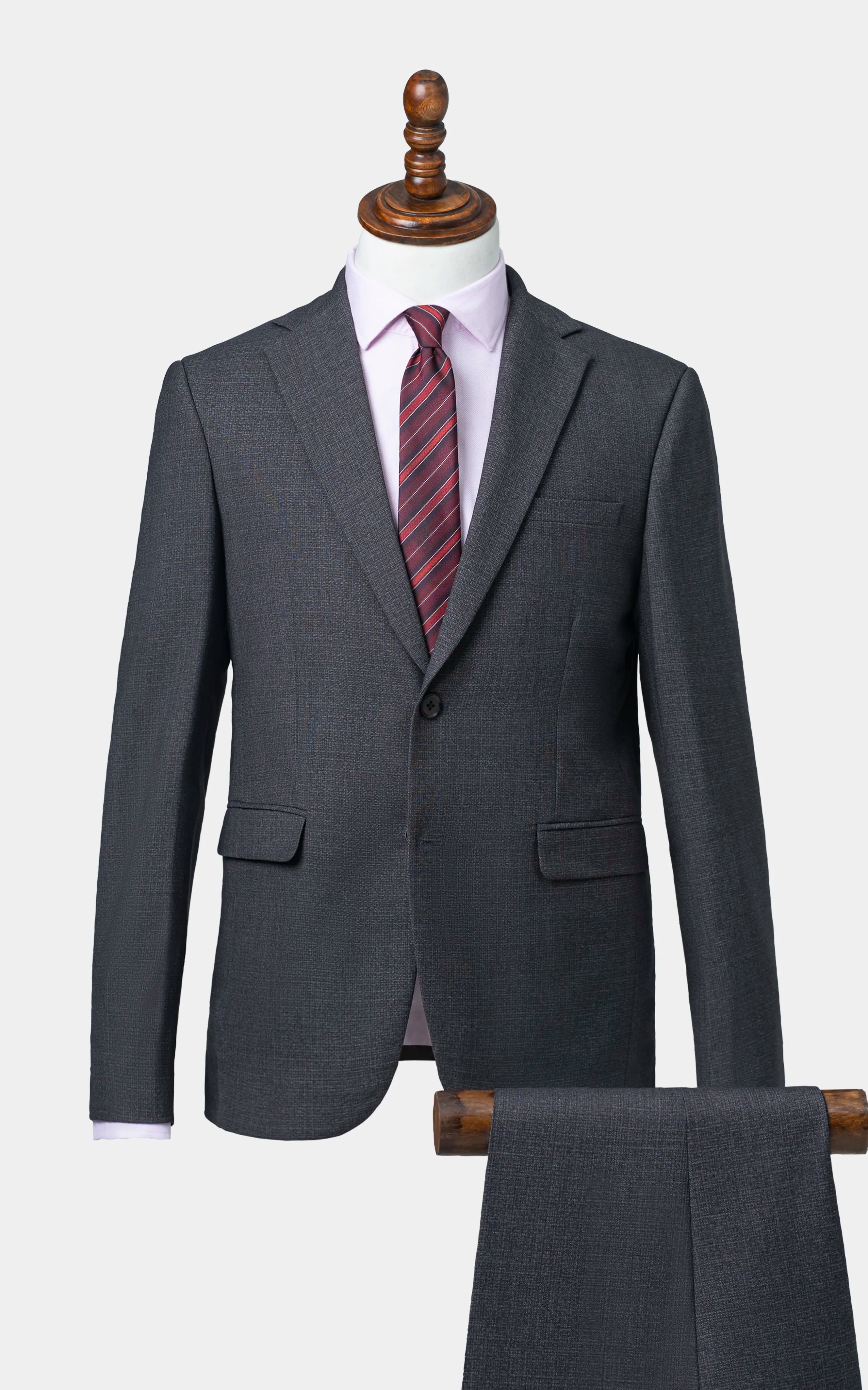 Two-piece suit jacket and matching trousers, dark charcoal color, notched lapels