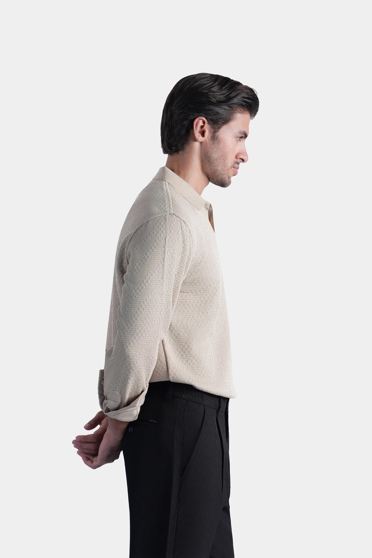 Khaki long-sleeve polo shirt with collar and self-textured pattern, side view