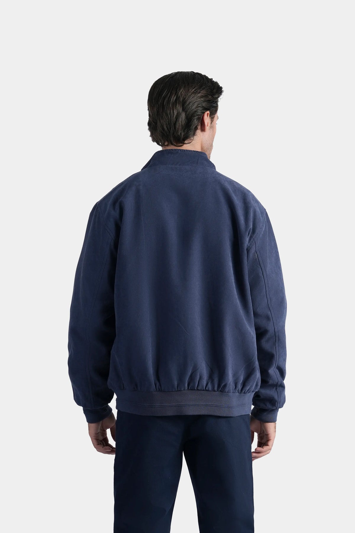 Reversible jacket back view in dark blue, ribbed cuffs and hem, front zip