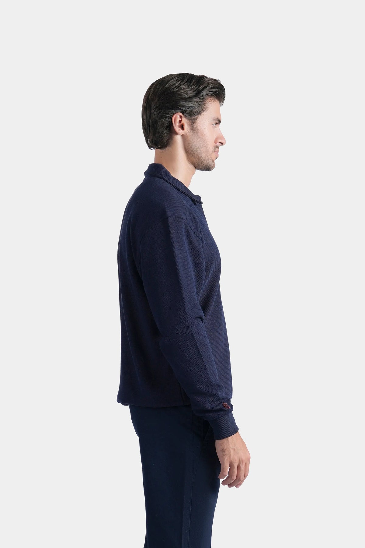 Navy full-sleeve zip polo shirt, side profile