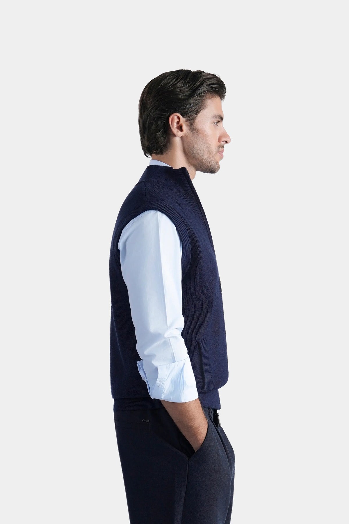 Navy sleeveless knitted sweater with high stand collar, side view