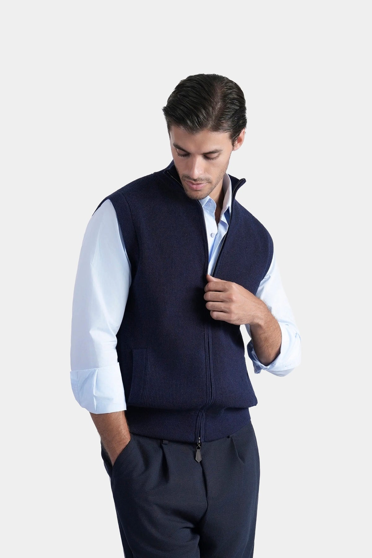 Navy sleeveless knitted sweater with high stand collar and zip placket detail
