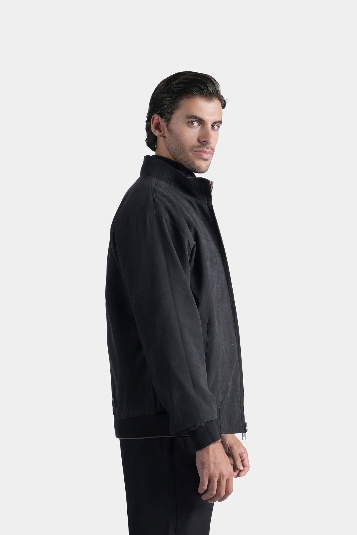 Charcoal reversible jacket side view, stand collar and zip front