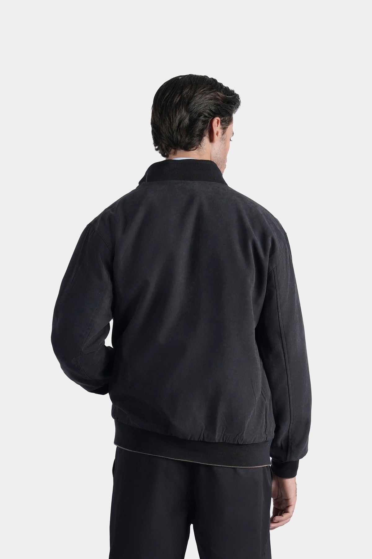 Charcoal reversible jacket back view with full sleeves and zip hem