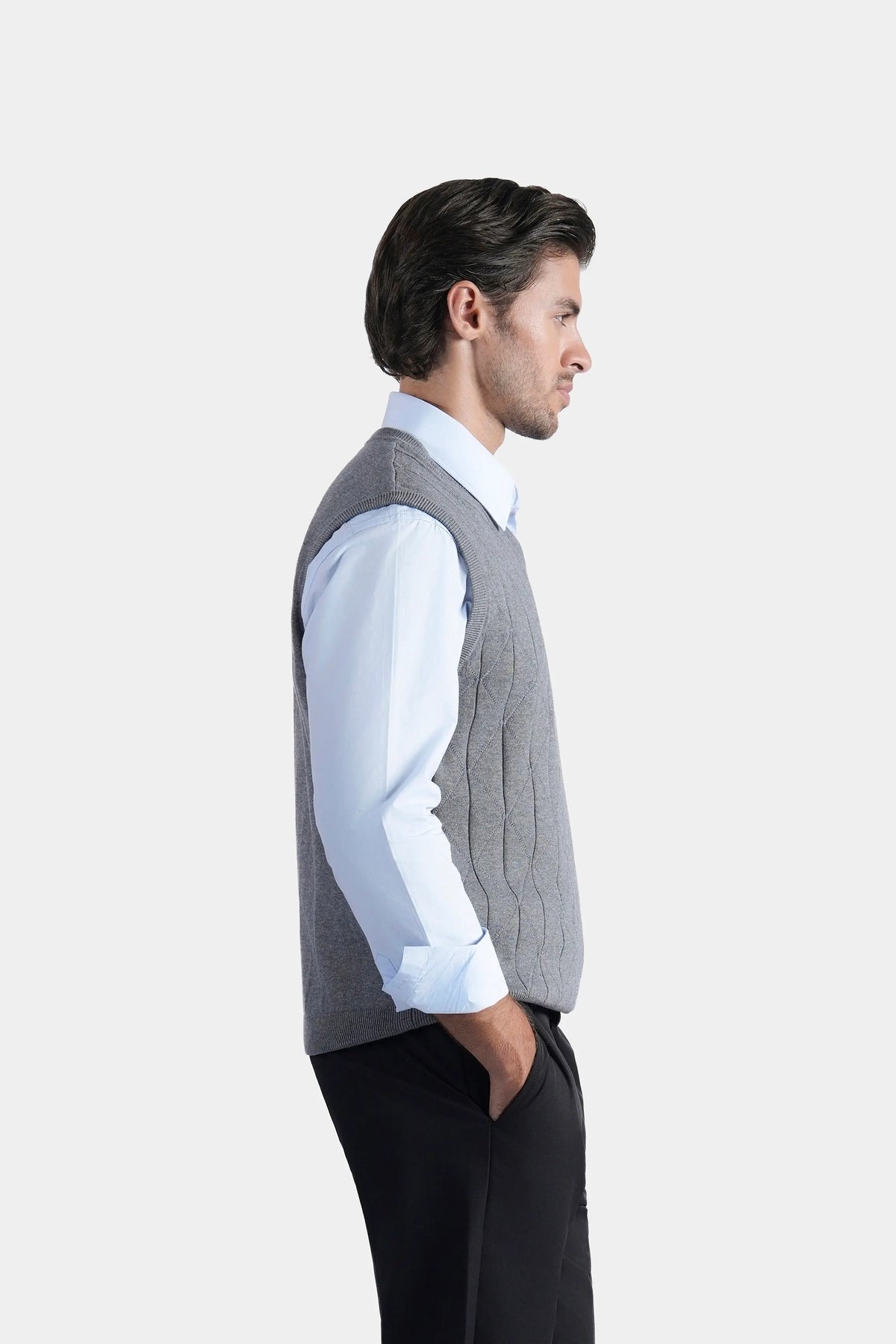 Grey sleeveless knitted V-neck sweater vest, side view showing armholes and knit texture