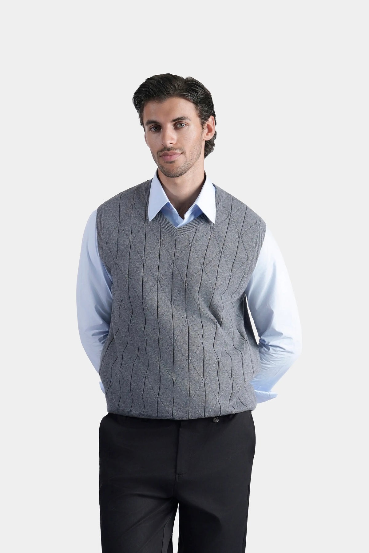 Grey sleeveless knitted V-neck sweater vest, front view with diagonal stitch texture