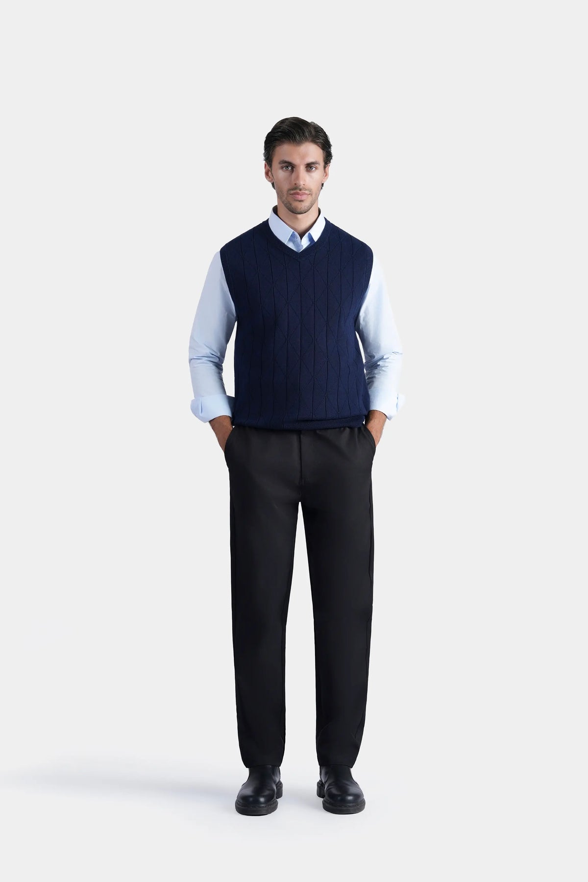 Navy V-neck sleeveless knit sweater with textured knit and fitted hem