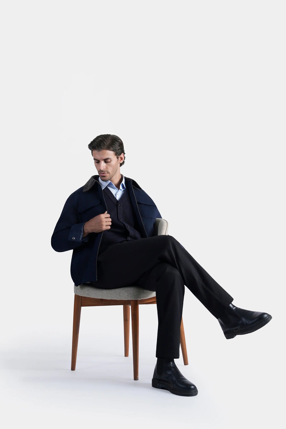 Relax fit navy jacket with flap pockets, dark collar, and long sleeves