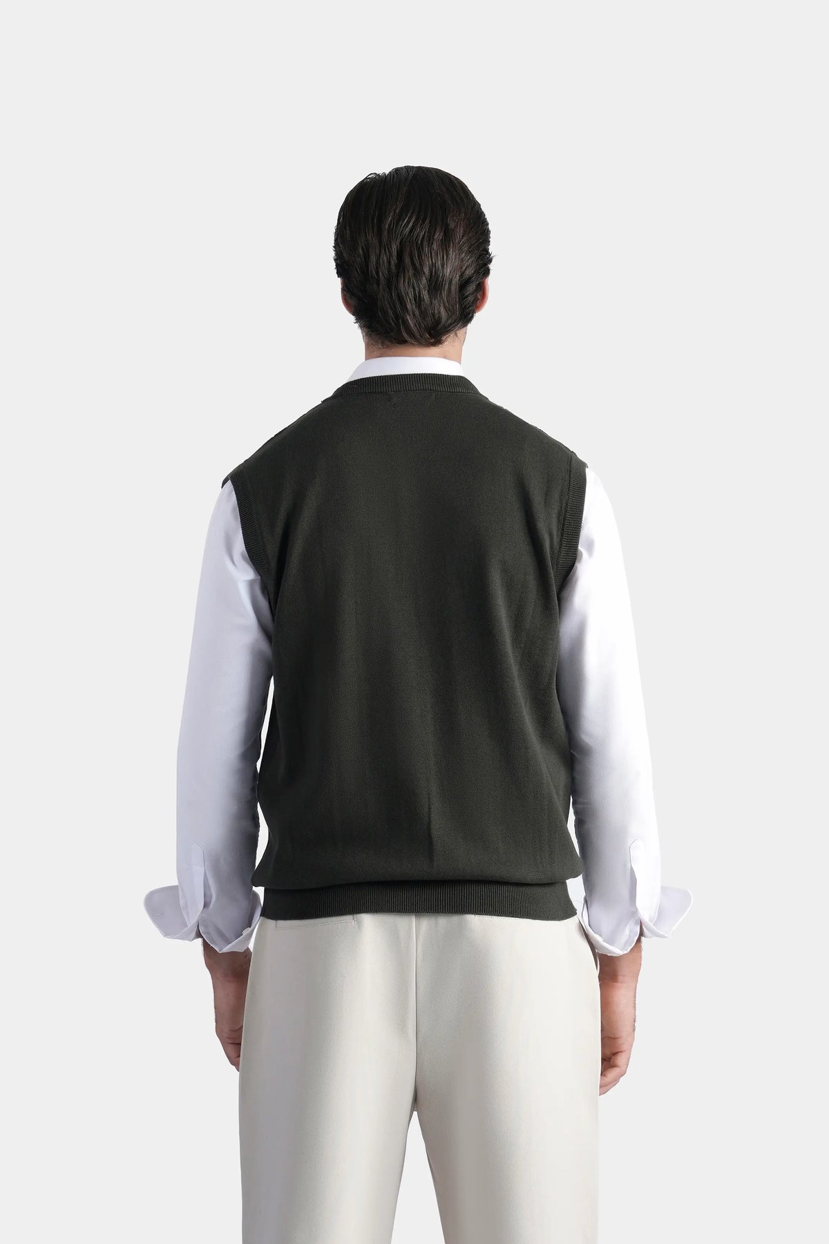 Sleeveless knit sweater vest in dark color, back view