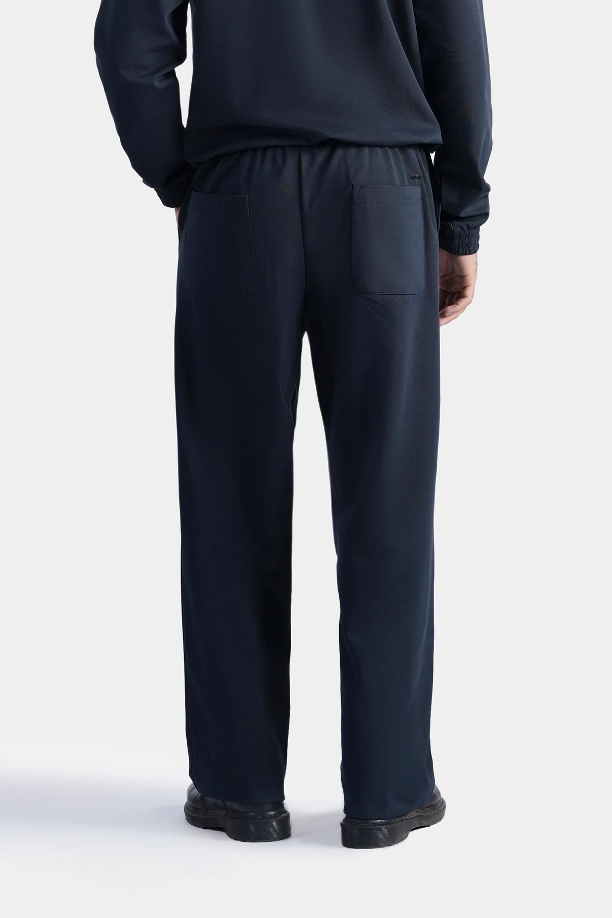 Navy scuba trousers with straight, relaxed legs and elastic waistband.
