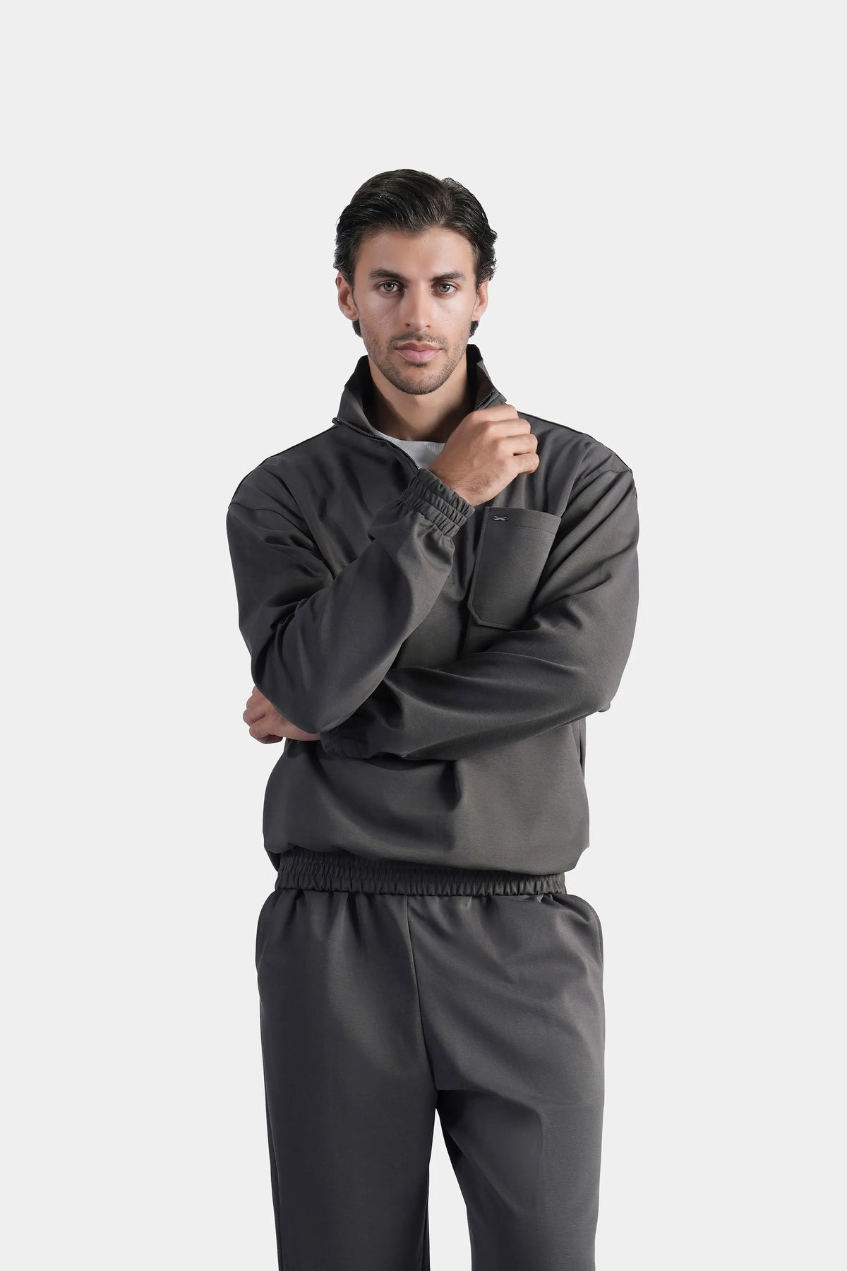 Grey quarter-zip mock neck pullover sweatshirt with ribbed cuffs and hem