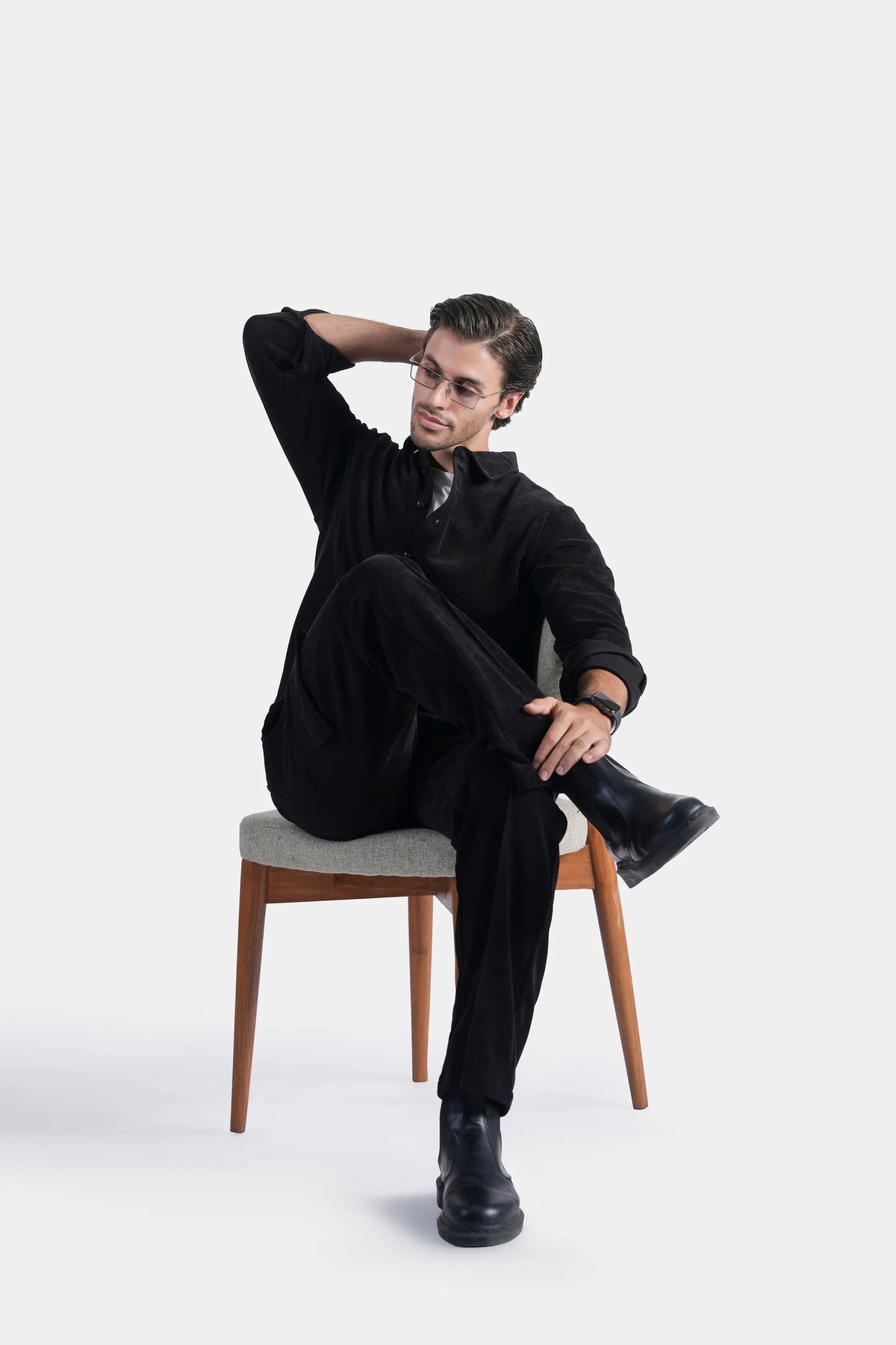 Black corduroy cargo trousers with flap pockets and relaxed straight legs