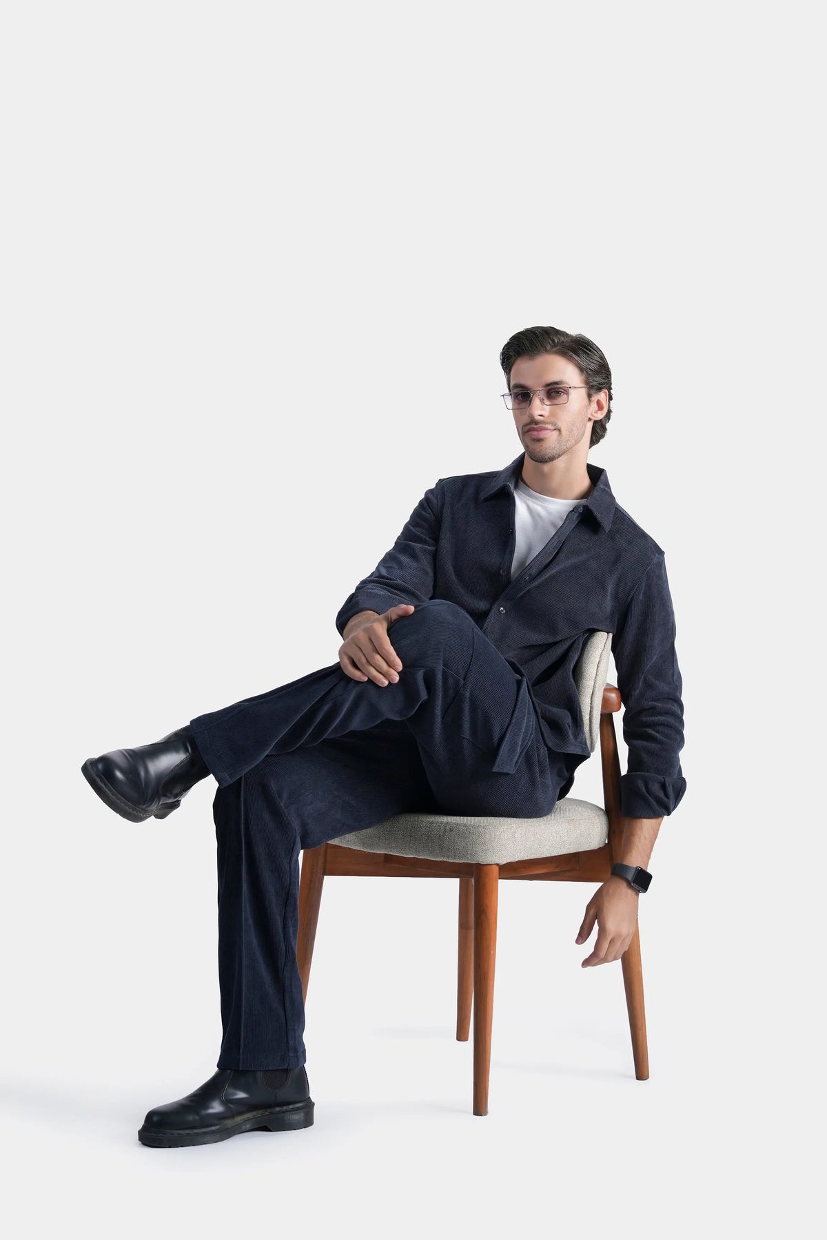 Navy corduroy cargo trousers with large side cargo pockets and relaxed straight legs