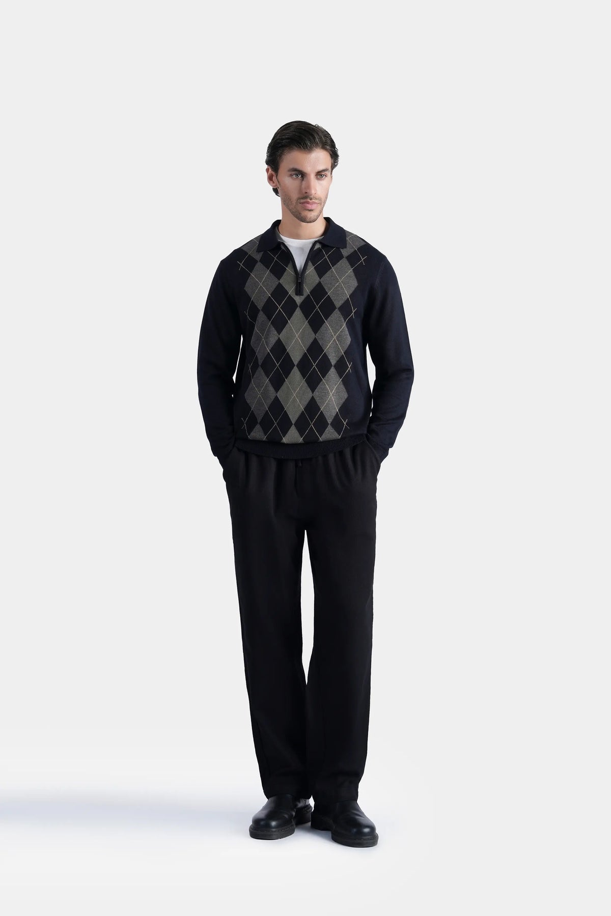 Men's black crew-neck knitted sweater with gray argyle pattern on front