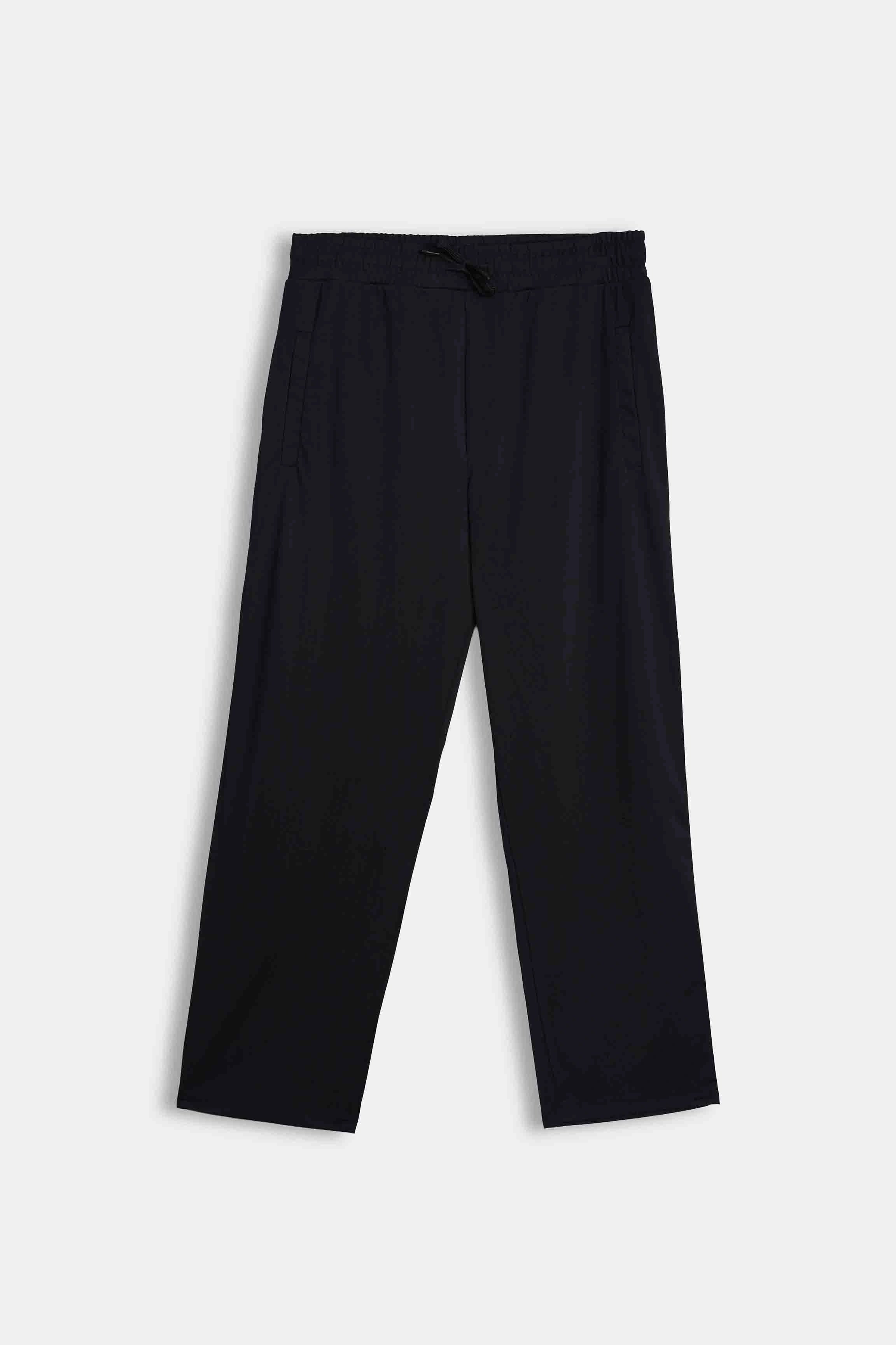 Black loose-fit trousers, laid flat, with elasticated waistband and wide straight legs