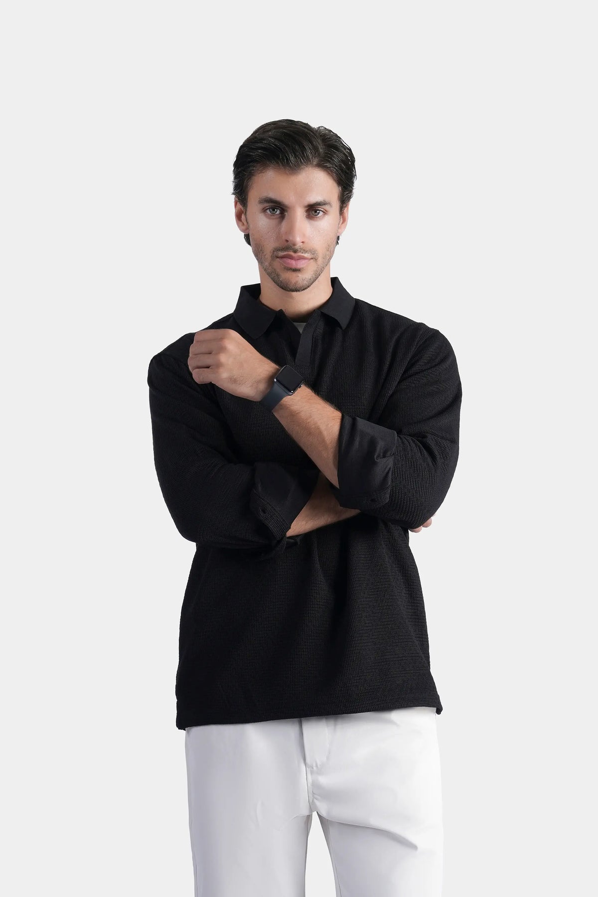 Black long-sleeve self-textured polo shirt with button placket and folded collar