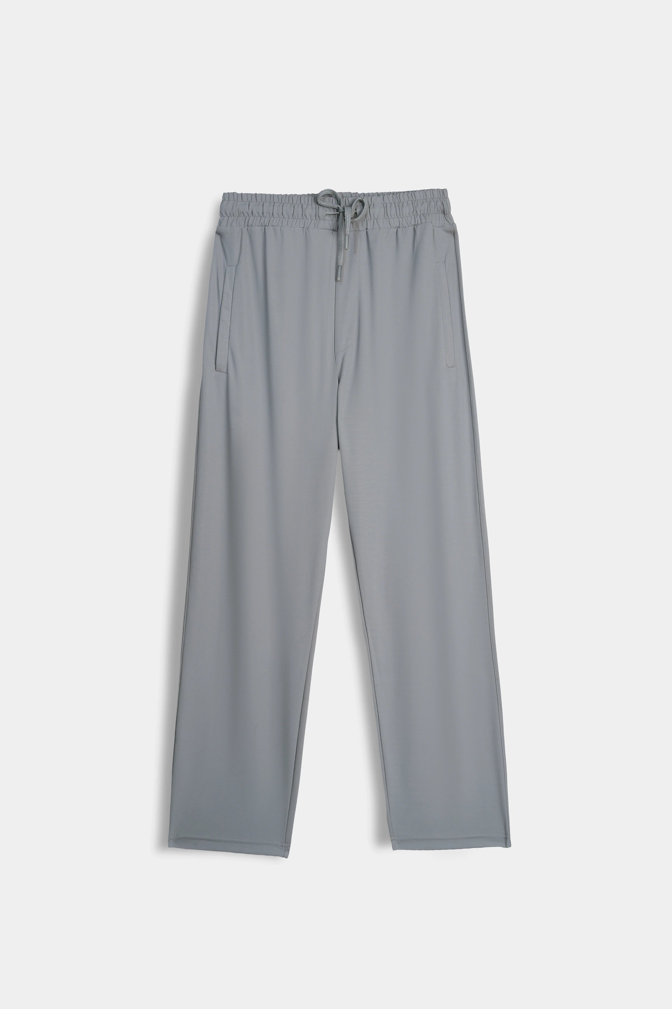 Grey loose trousers with elastic drawstring waistband, straight wide legs, flat lay.