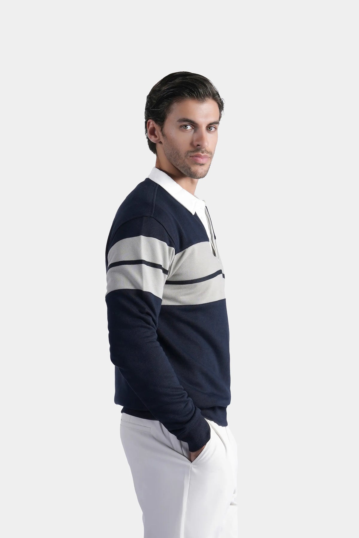 Navy rugby polo shirt with white horizontal stripes, long sleeves, side profile