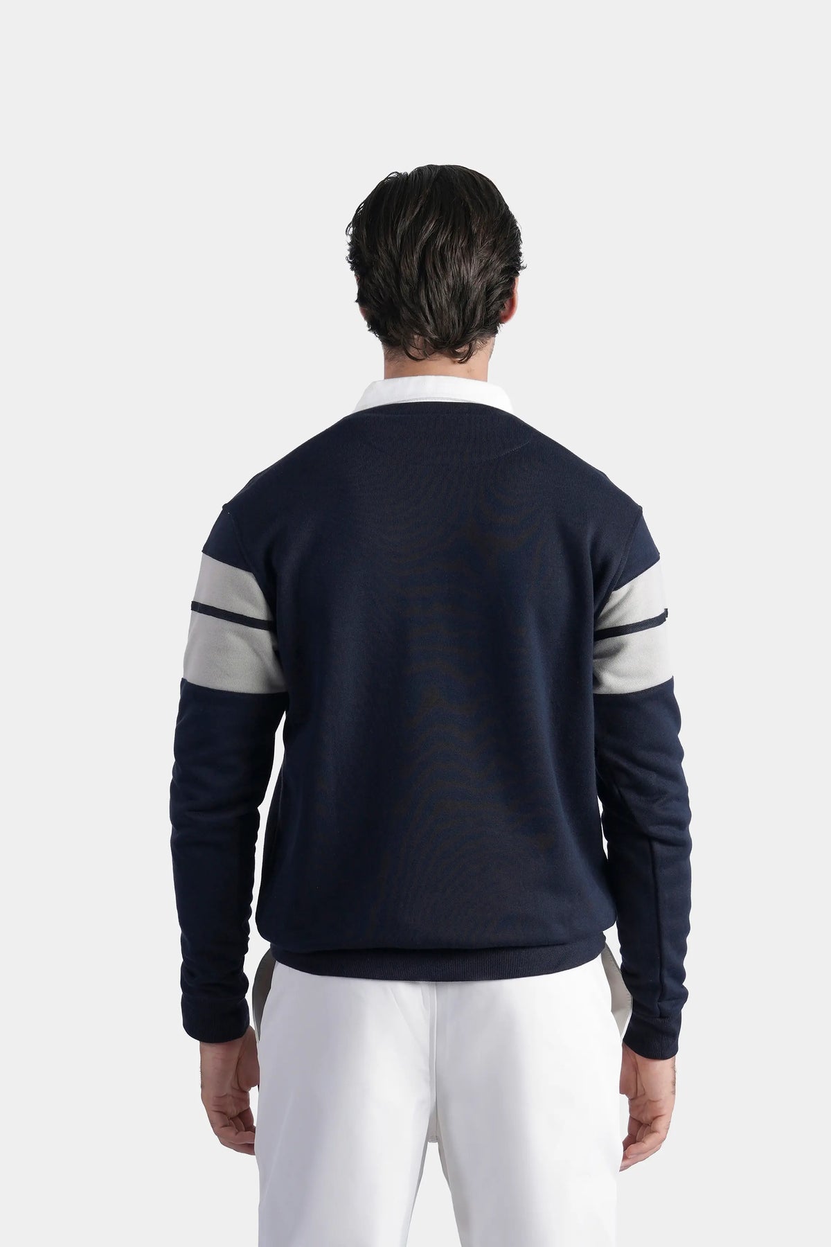 Navy rugby polo shirt back view with white stripe bands across shoulders