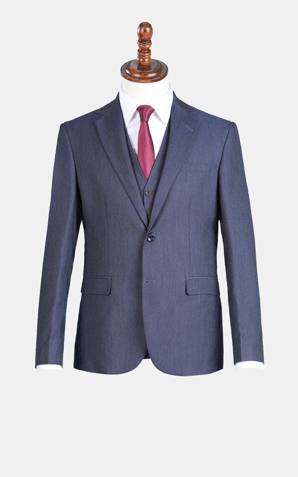 Teal blue slim-fit suit set on mannequin: jacket, vest, and matching trousers.