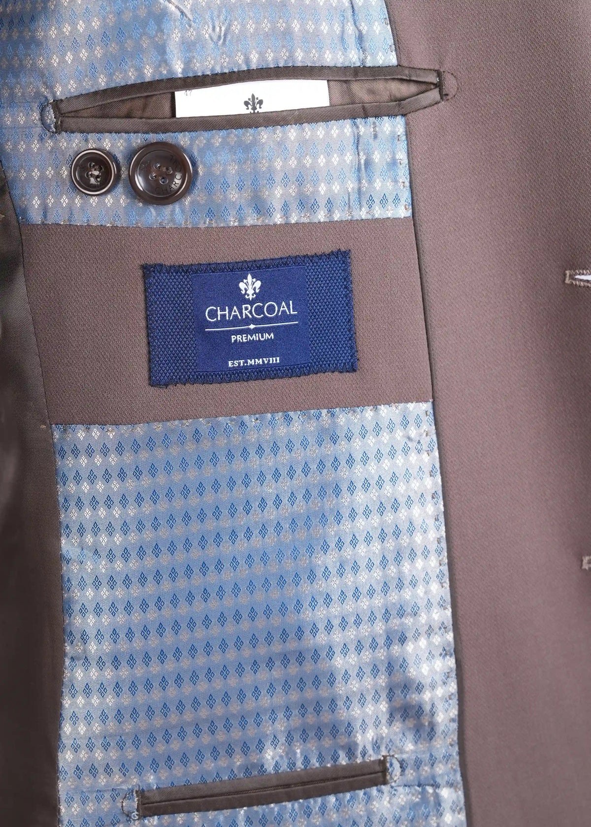 Brown suit jacket lining with CHARCOAL brand label and blue patterned fabric panels
