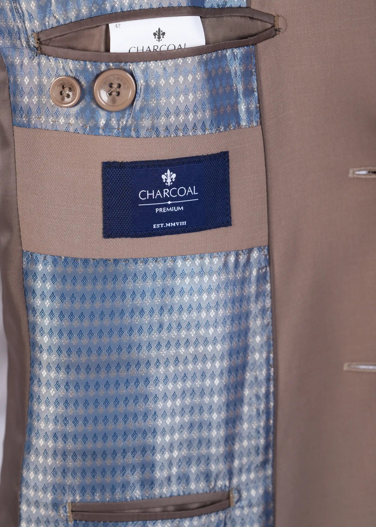 Suit trousers interior with waistband label reading CHARCOAL and button detail
