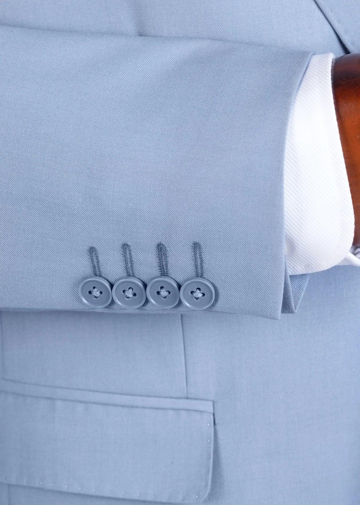 Smoke blue suit jacket sleeve cuff with four buttons and flap pocket