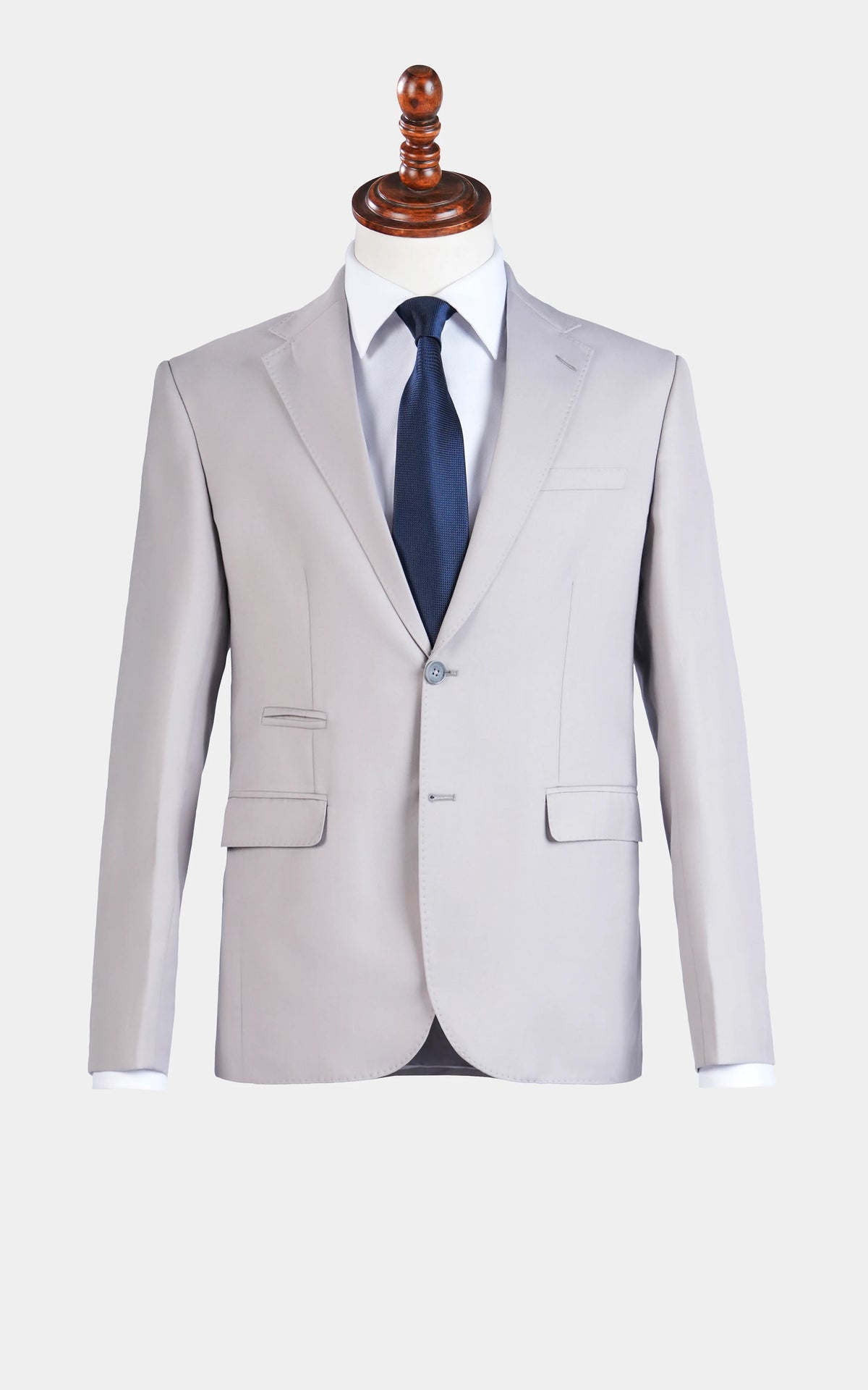 Stone gray two-piece suit with notch-lapel jacket and matching vest, navy tie