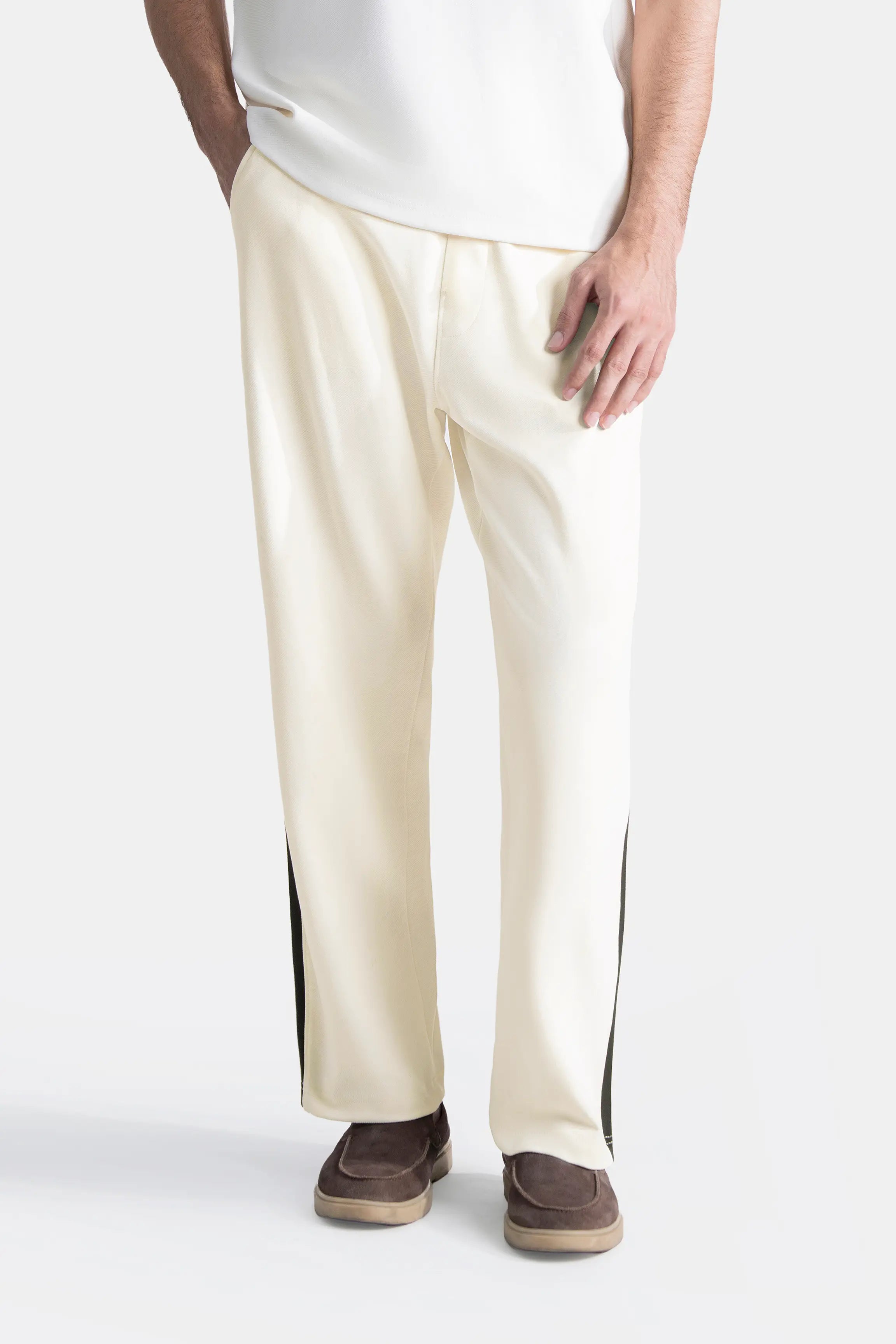 Off-white loose trousers, relaxed leg, black contrast side stripe