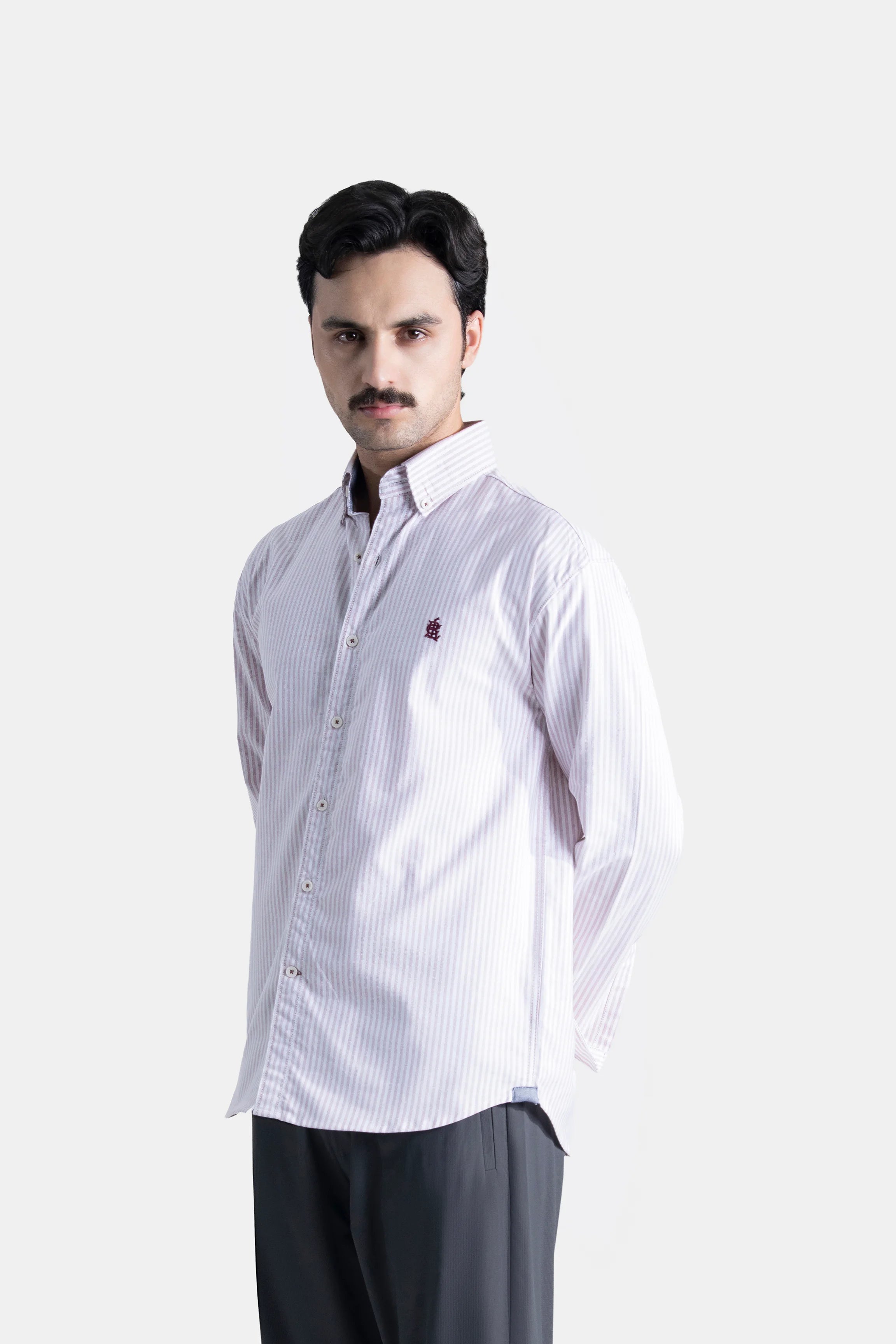 Pink striped button-down casual shirt with long sleeves and button front