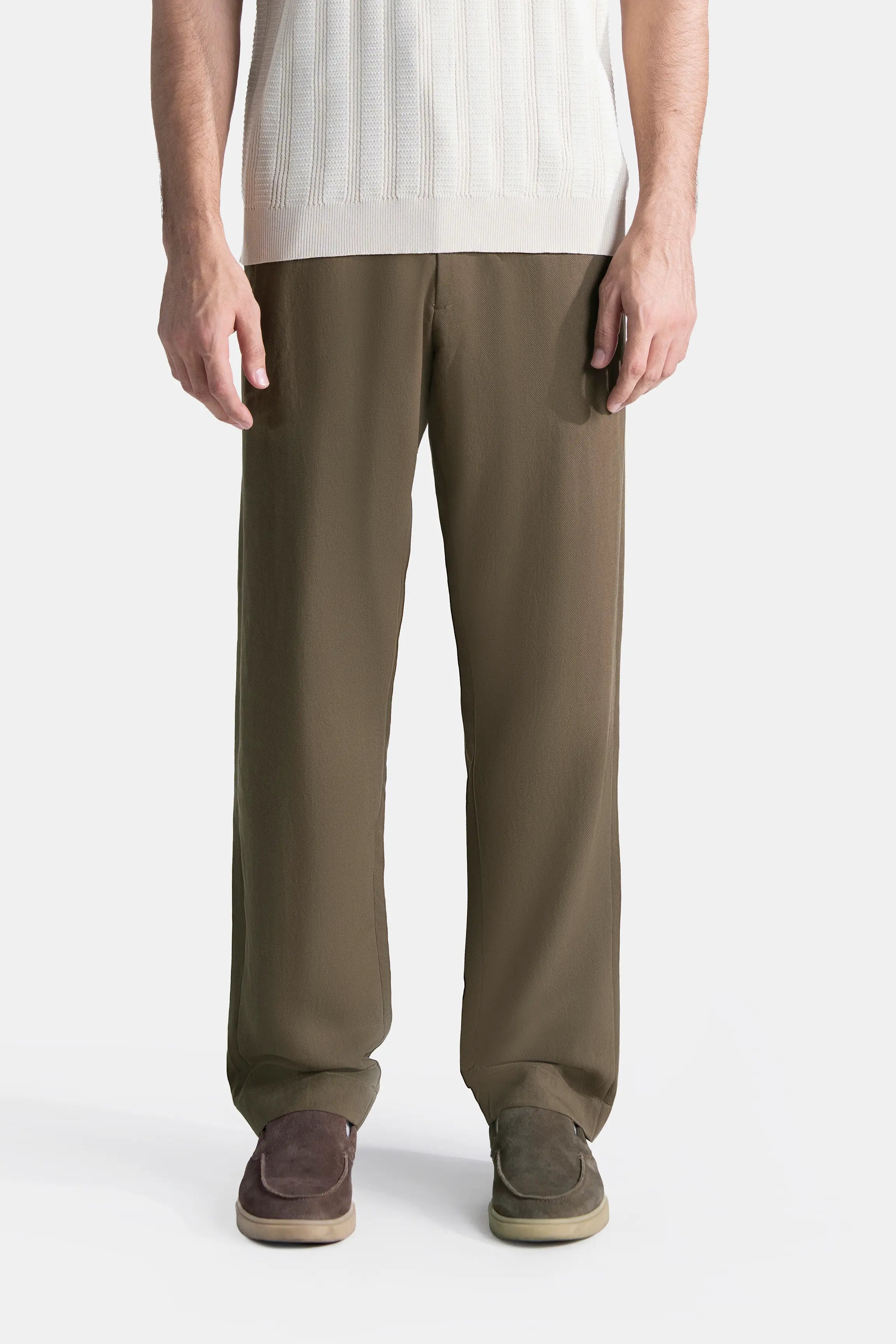 Straight-fit brown pants with cross pocket design, front view