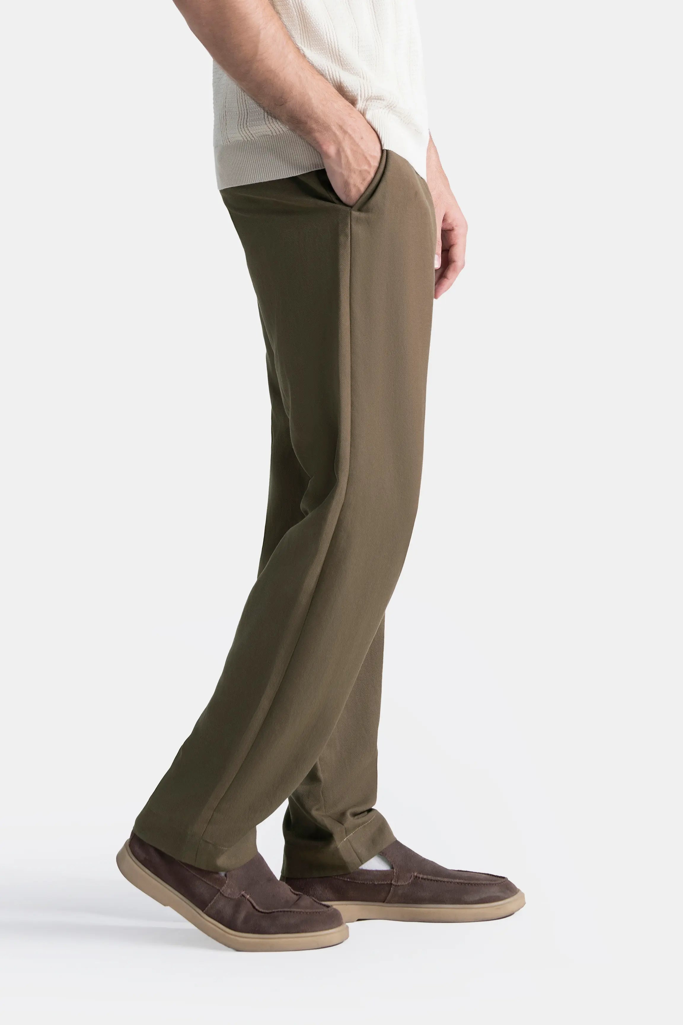 Straight-fit brown pants, side view showing cross pocket detail at the waist