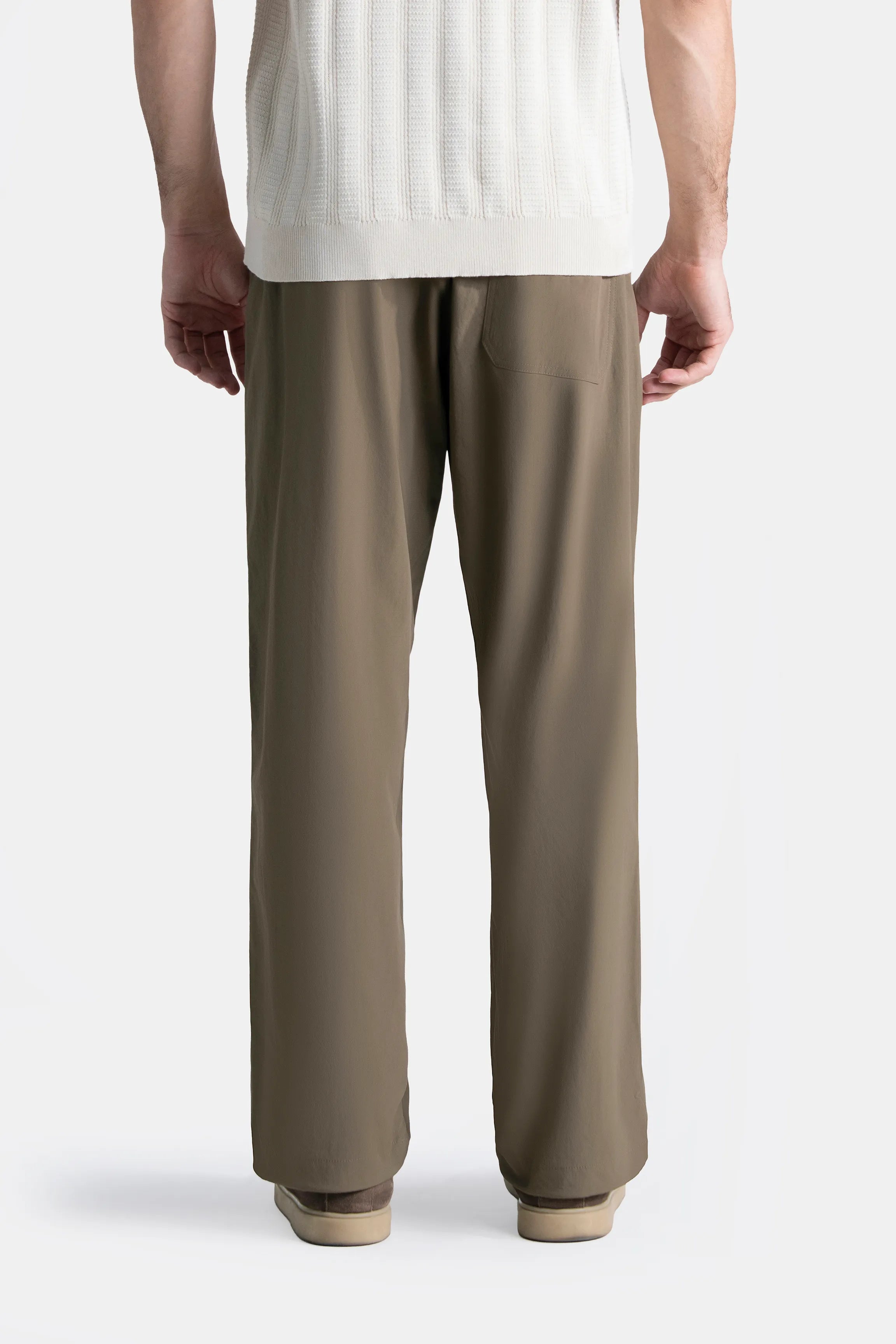 Olive loose-fit casual trousers from the back with relaxed straight leg fit