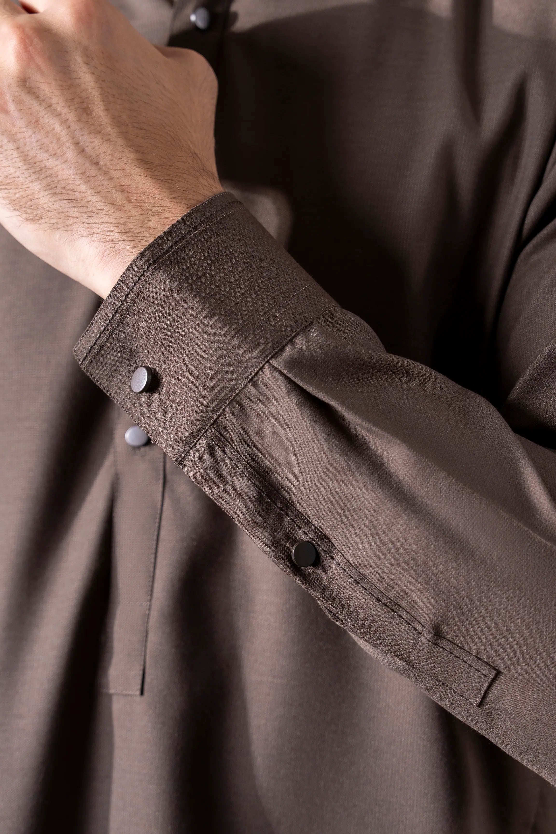 Dark brown kameez shalwar cuff and placket detail with buttons and pocket