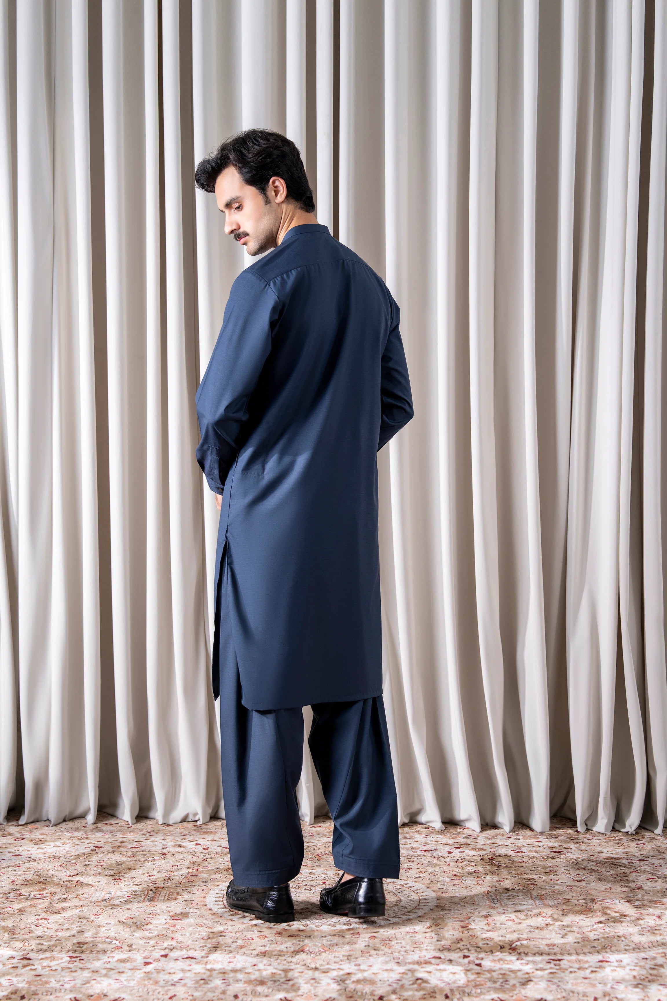 Indigo kameez and shalwar set, three-quarter back view