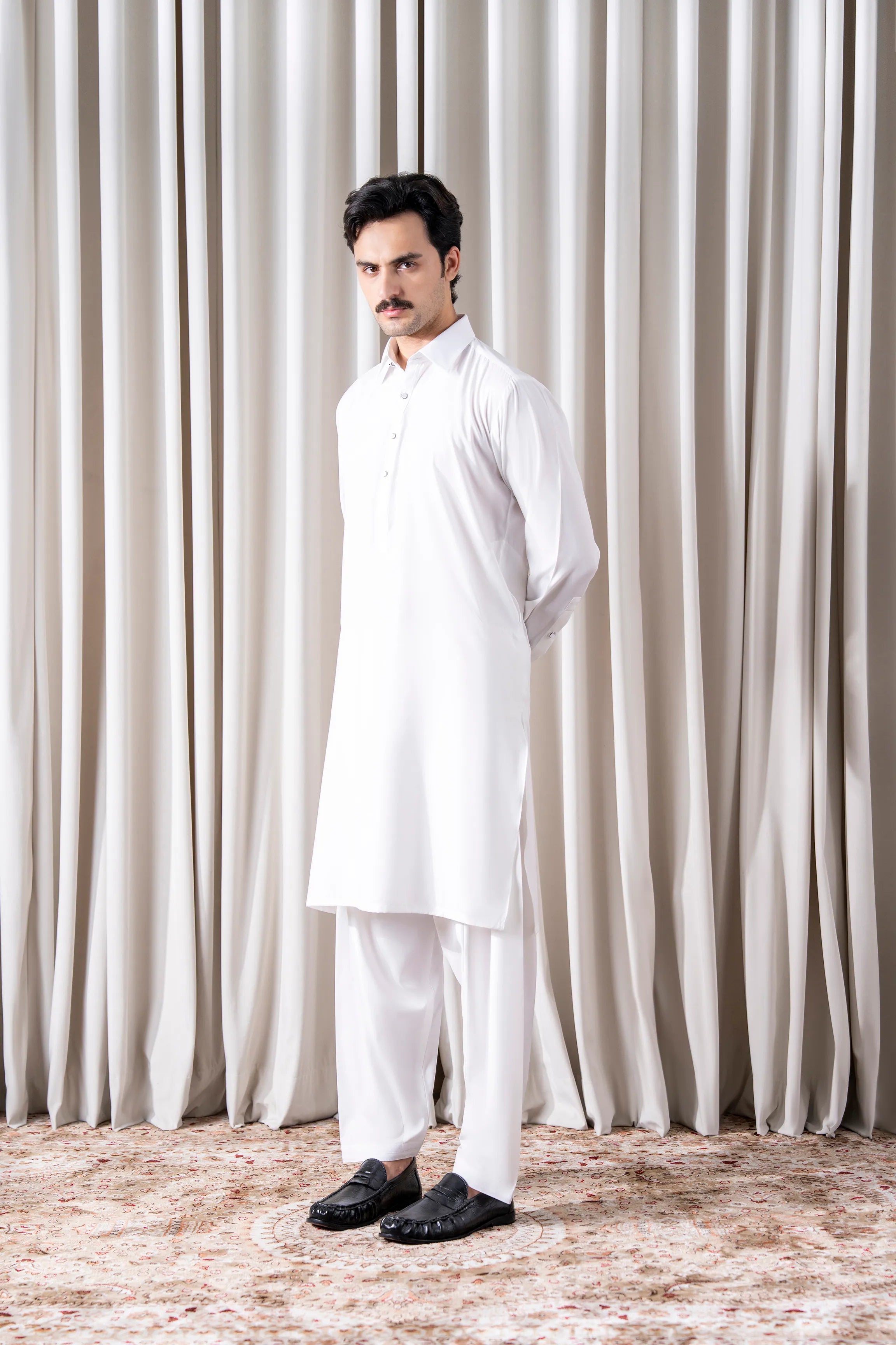 White textured kameez shalwar set with long sleeves and straight-leg trousers