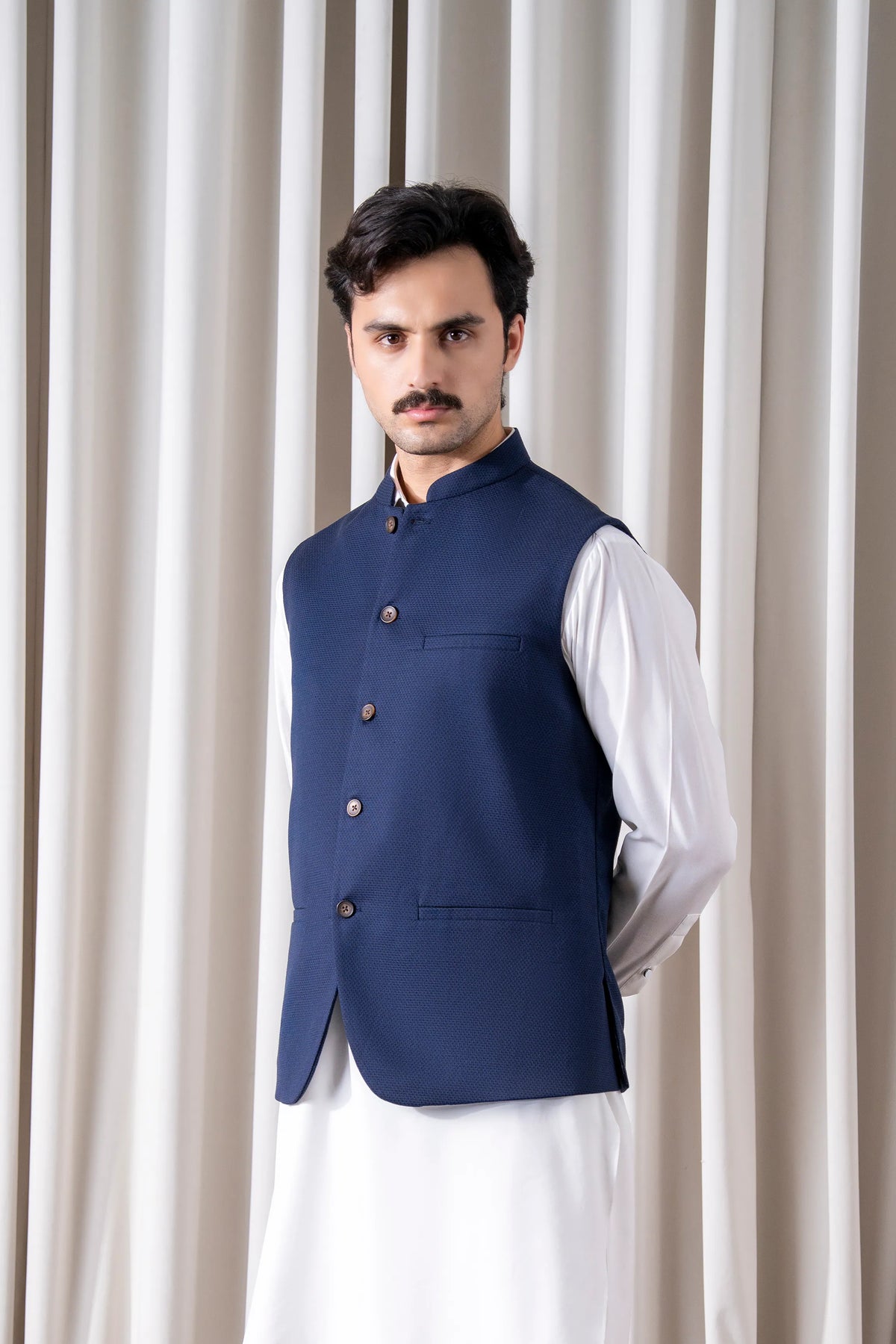 Navy cotton linen waistcoat with stand collar and four-button closure