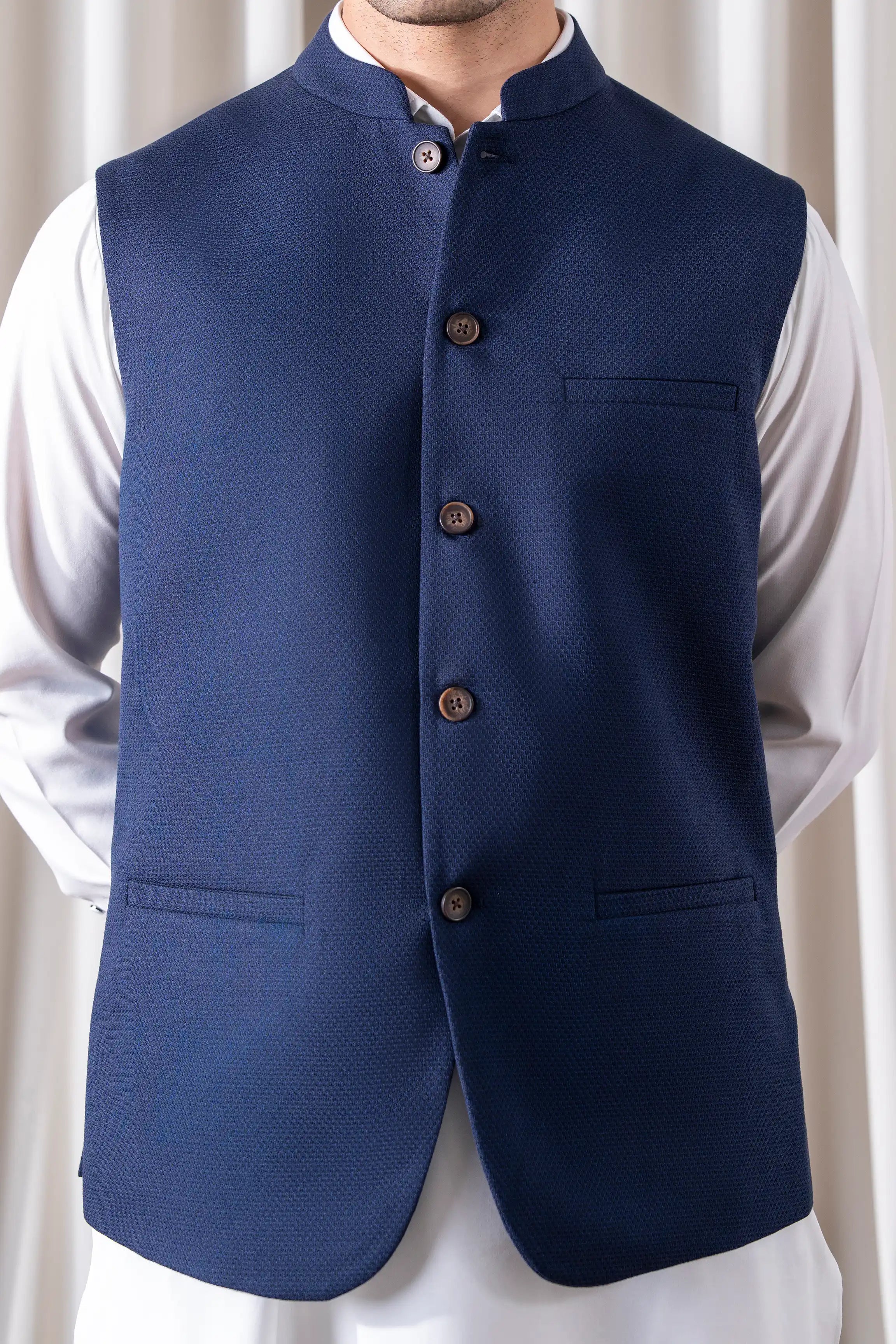 Navy cotton linen waistcoat close-up with stand collar and buttoned front pockets