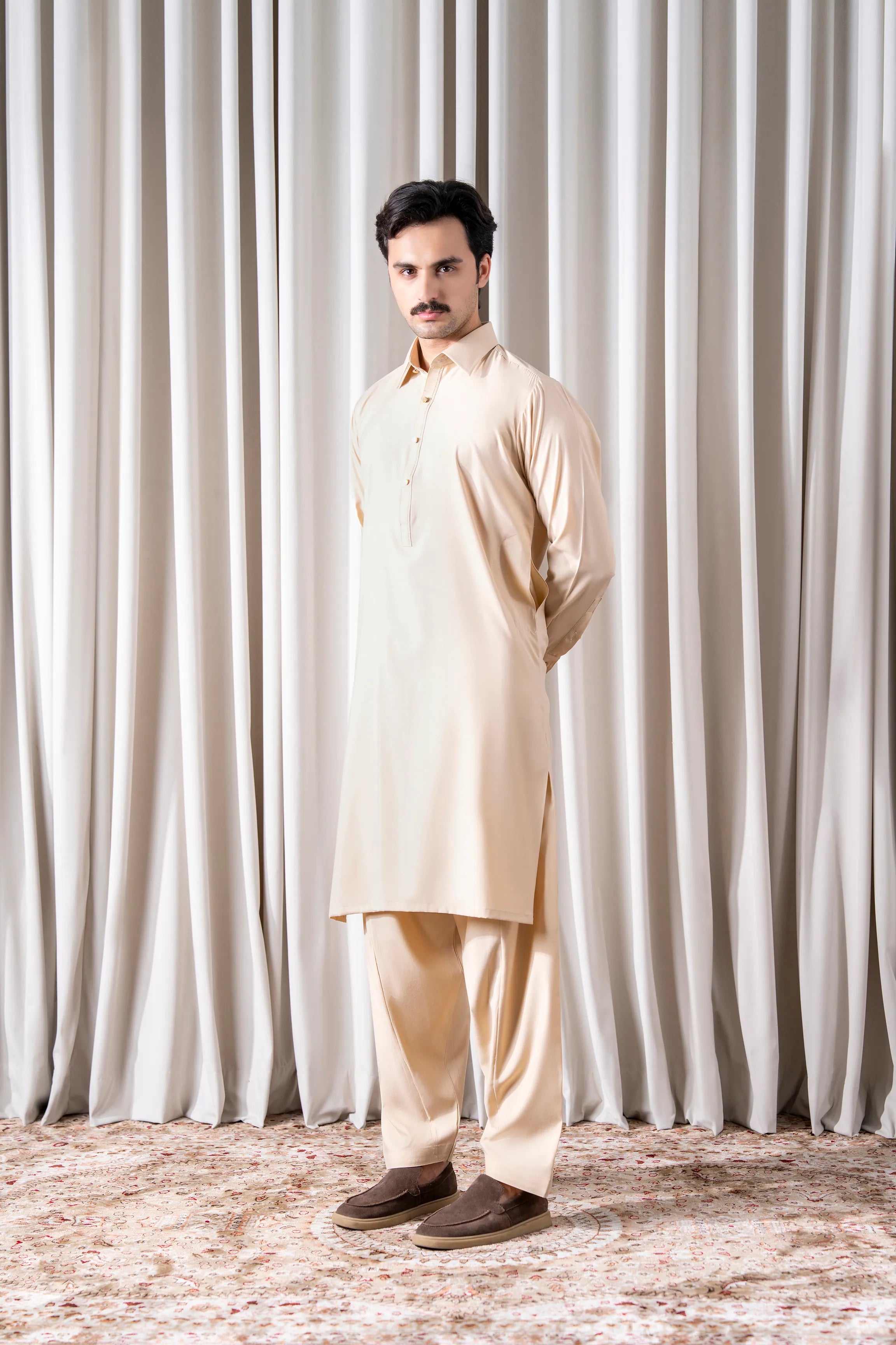 Beige kameez and shalwar set with button placket, long sleeves, and loose trousers