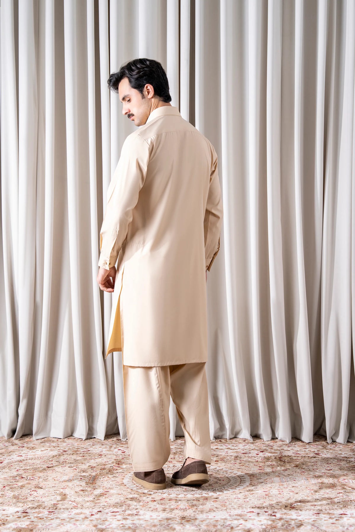Beige textured kameez and shalwar set, side view with long tunic and matching pants