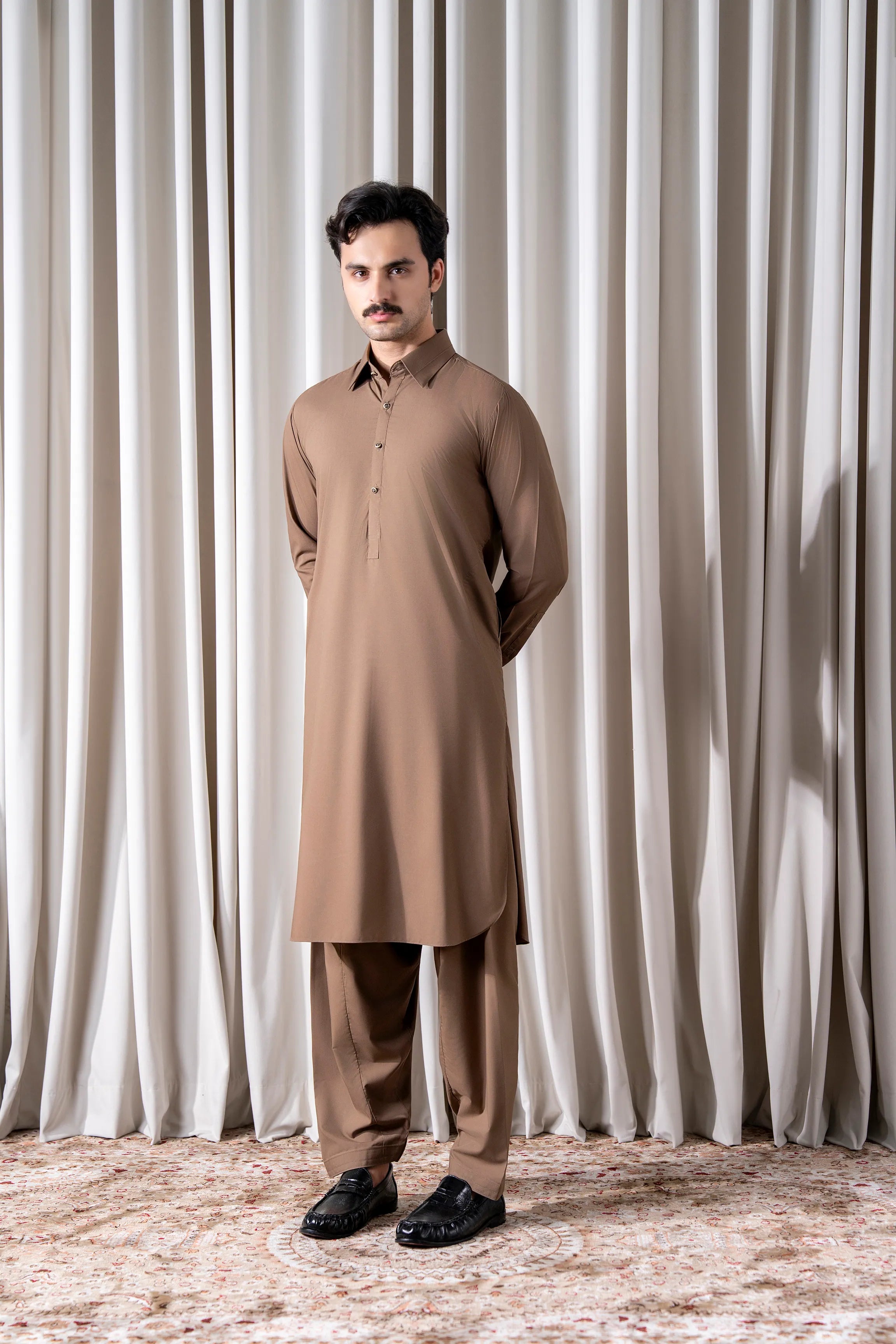 Dark khaki kameez and shalwar outfit with long sleeves and front button closure